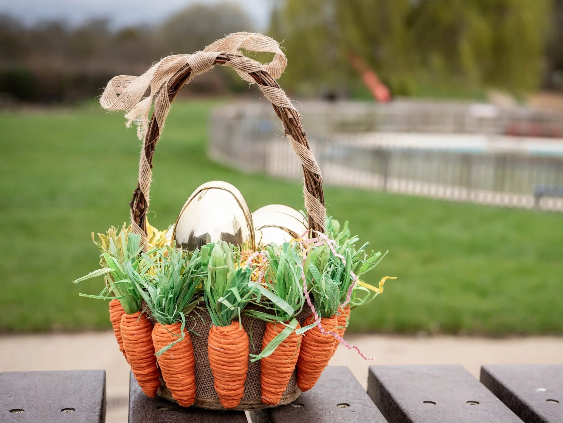 A wicker basket full of golden eggs