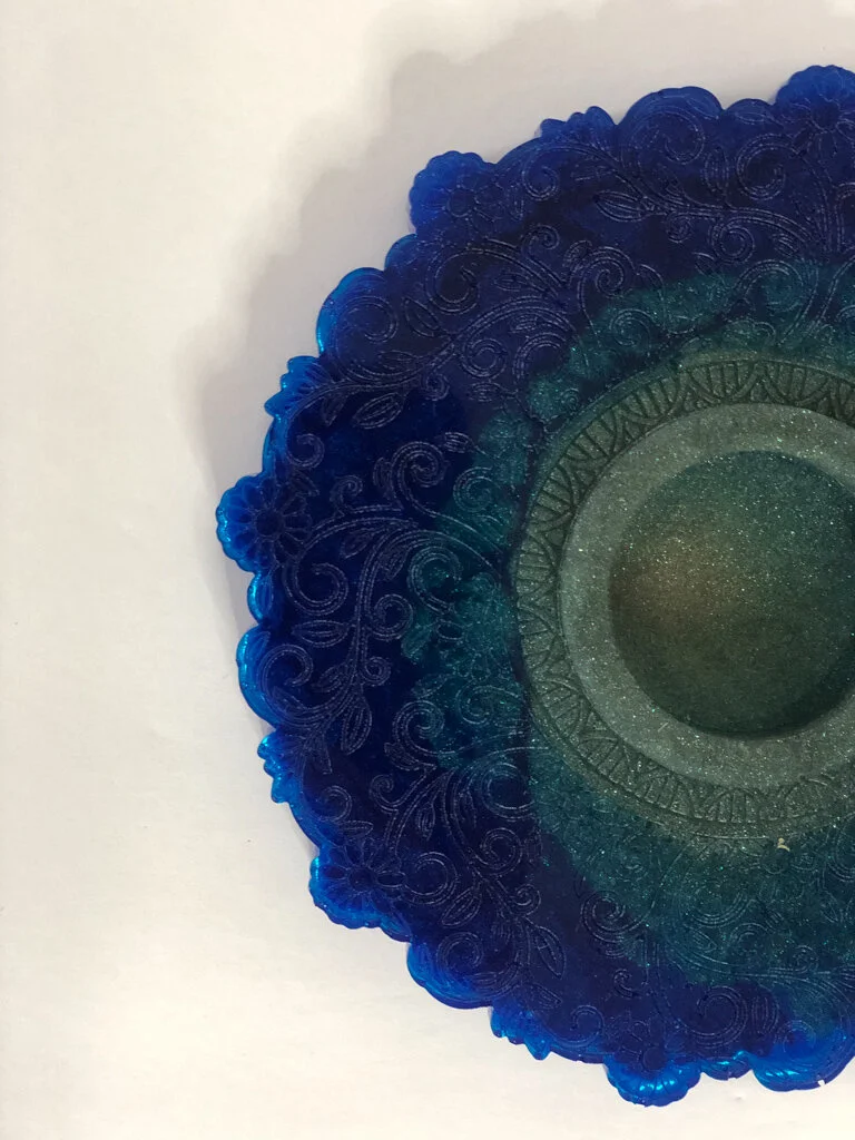 Embossed tea light candle holder