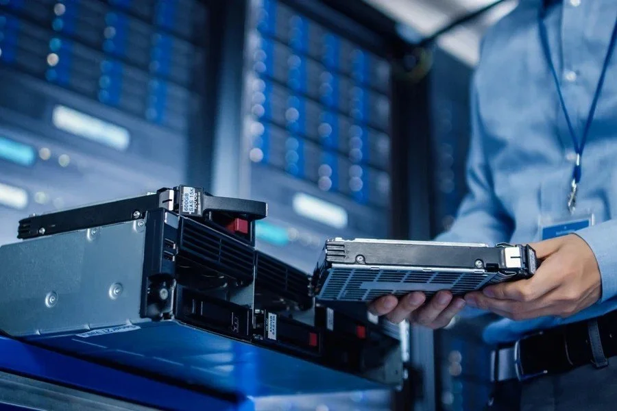 Engineer-holding-new-HDD-for-server-rack.jpg