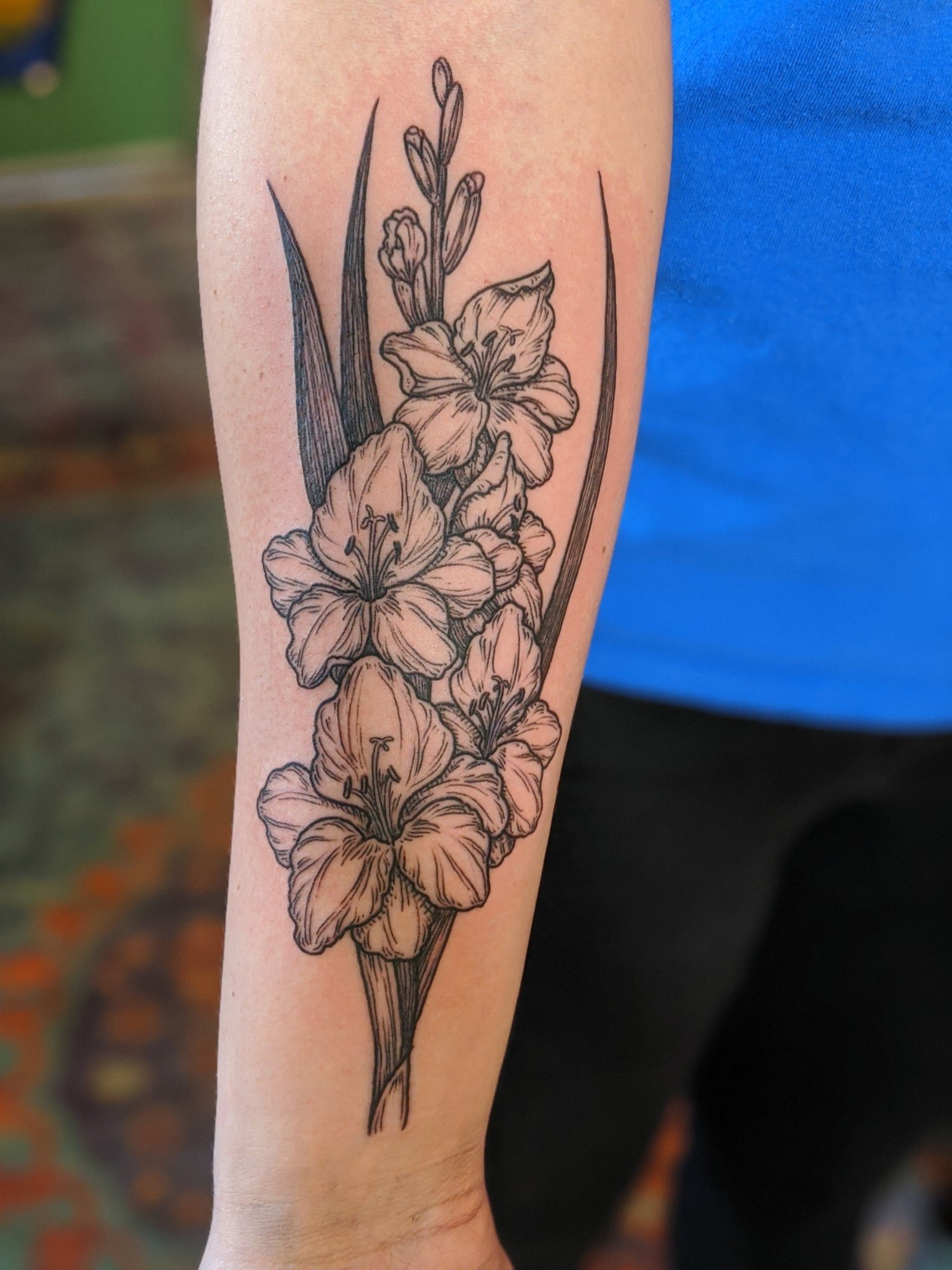 Onyx Ink - Gladiolus flowers 🙂 done by Alisha! . . . . . . . . . . . . . .  #seasonalfloralstyle #flowers #flowerlove #tattooartist #lakechamplain  #onyxink #flowerslovers #burlingtonvermont #vermonttattoo #