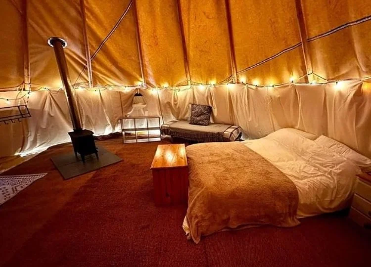 Furnished tipi with woodburner