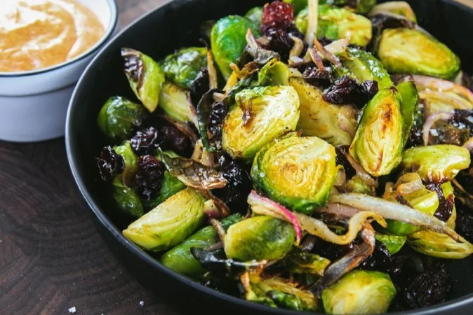Roasted Brussels Sprouts with Red Onions Dried Cherries and Chili Aioli