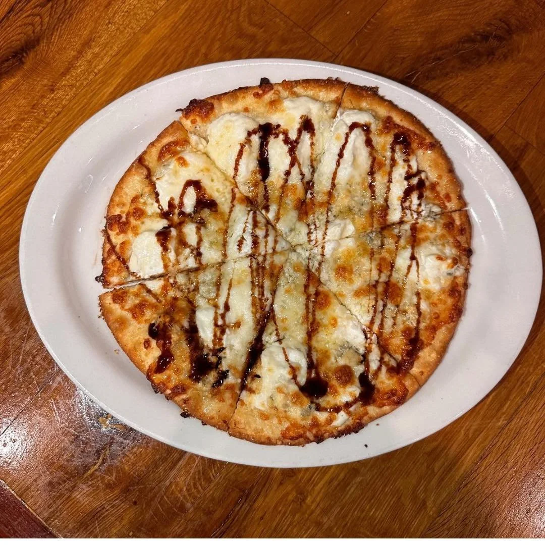 🔥 Individual Pizza of the Week 🔥

Say hello to the 
Quatro Formaggio Pizza
 &mdash; Ricotta, Parmesan, bleu cheese, and mozzarella all living their best life under a drizzle of honey 🍯🍕

It&rsquo;s bold. It&rsquo;s bougie. 
It&rsquo;s giving &ldq