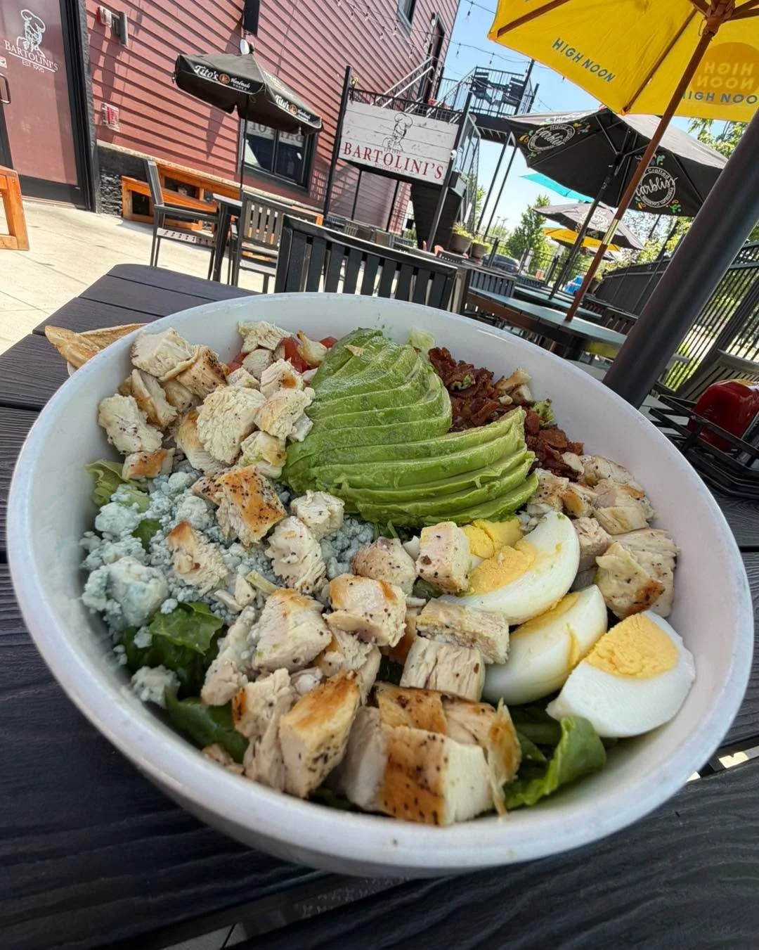 Patio season called&hellip; 
and she said maybe skip the heavy stuff today. ☀️🍴

Say hello again to one of the lighter stars on our menu 
&mdash; the Cobb Salad. 
Crisp greens, fresh toppings, 
BIG flavor, and patio vibes that just hit different wit