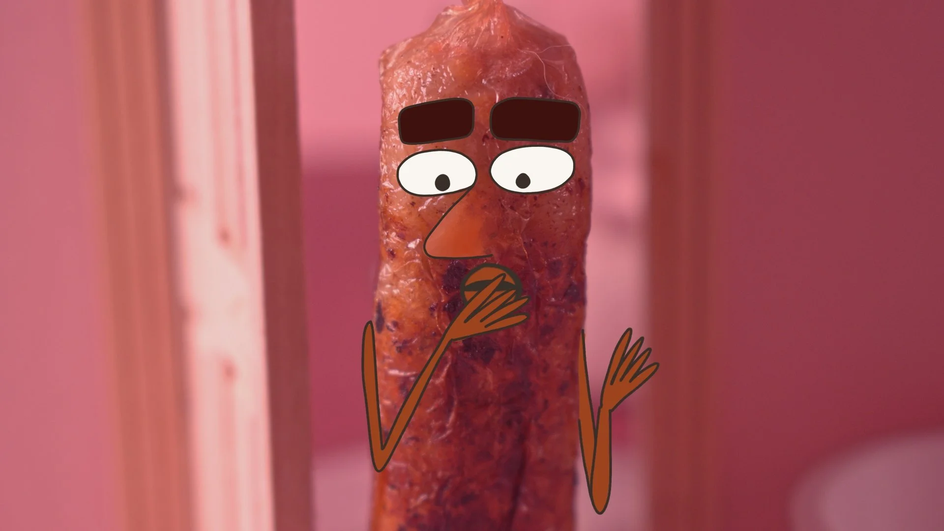 a surprised stop-motion animated sausage character