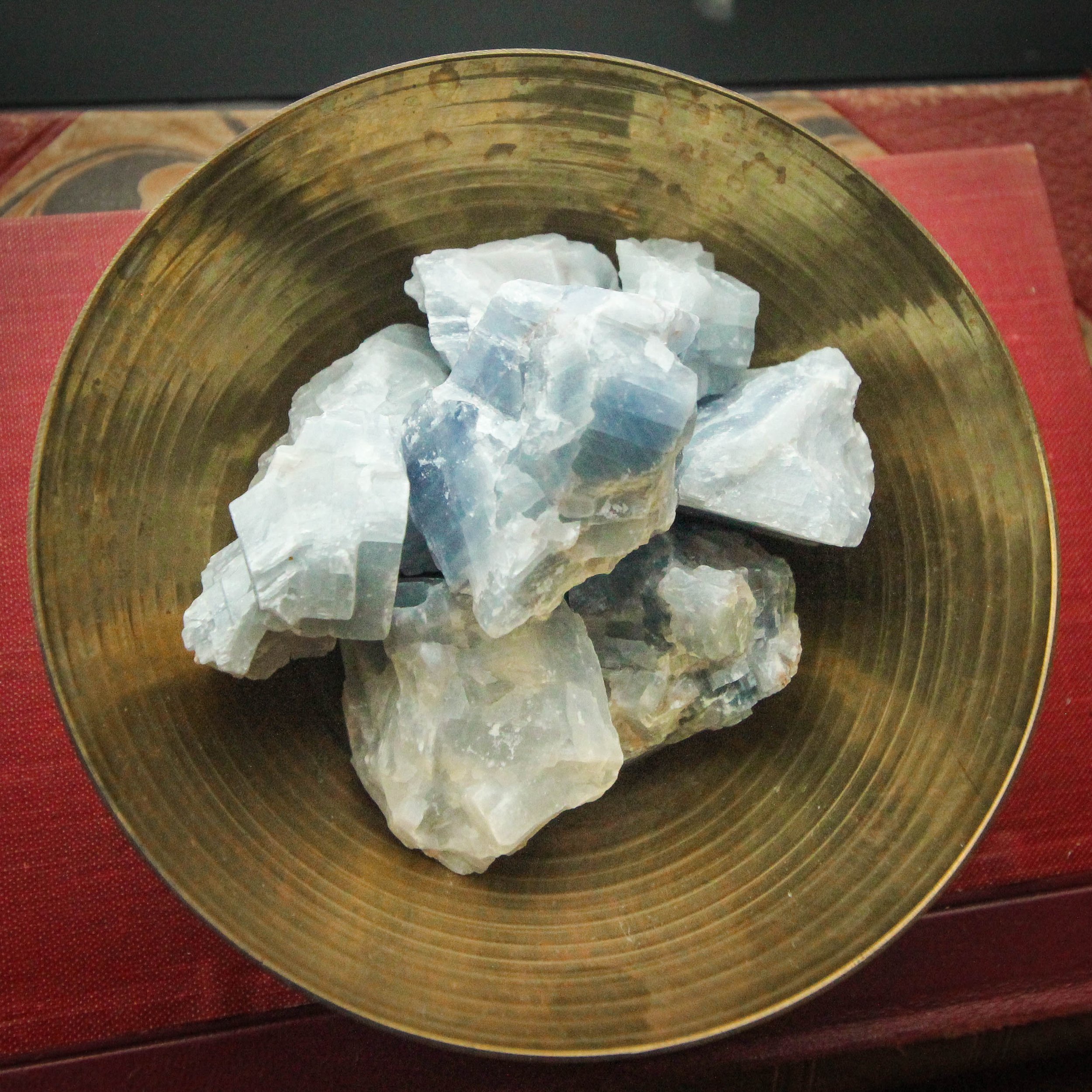 Blue Calcite Raw Stone in a gold bowl