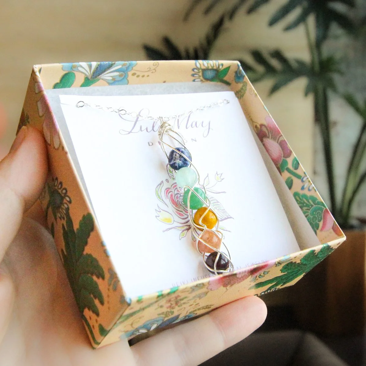 7 Chakra Spiral Necklace in Box.JPG