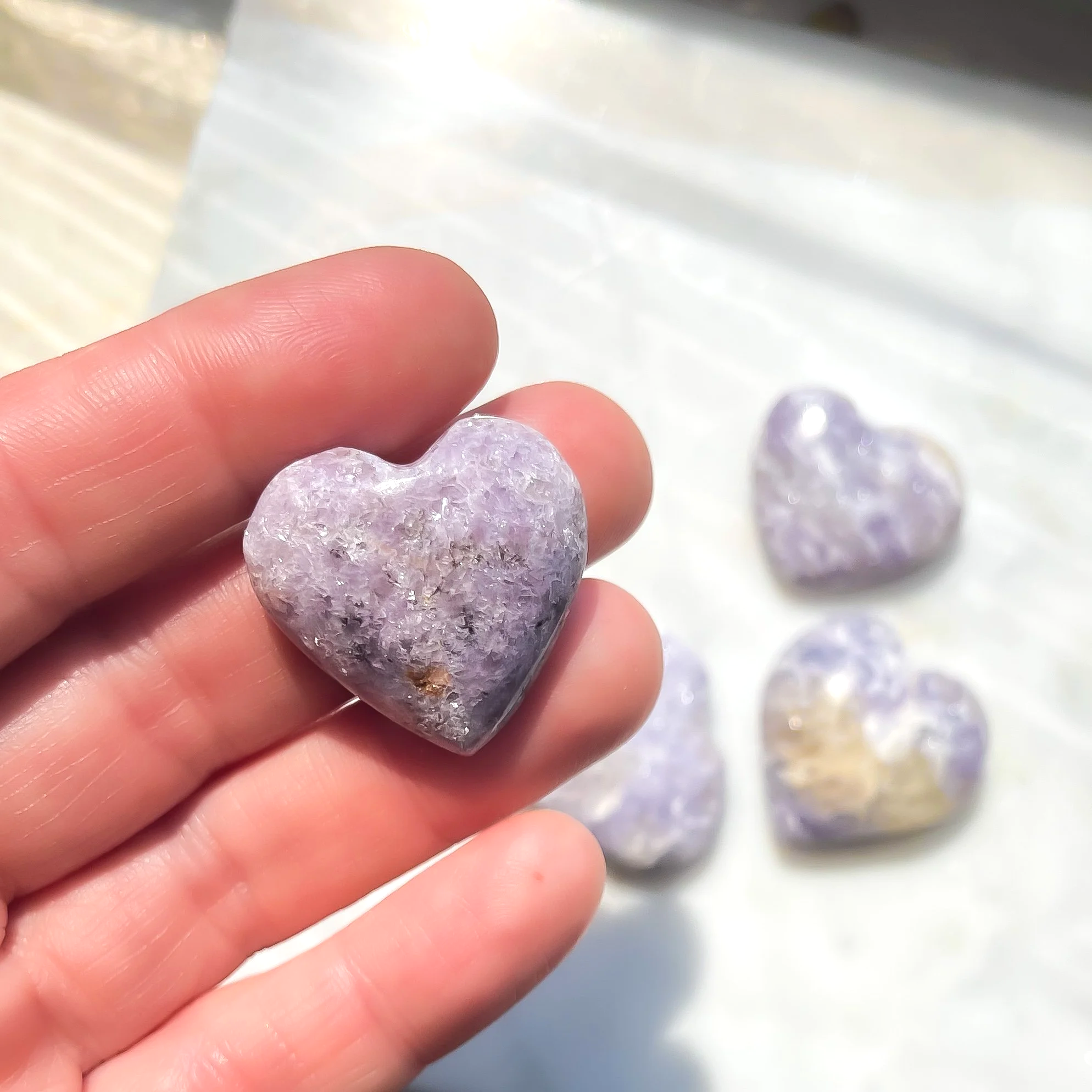 lepidolite+heart+in+hand.png