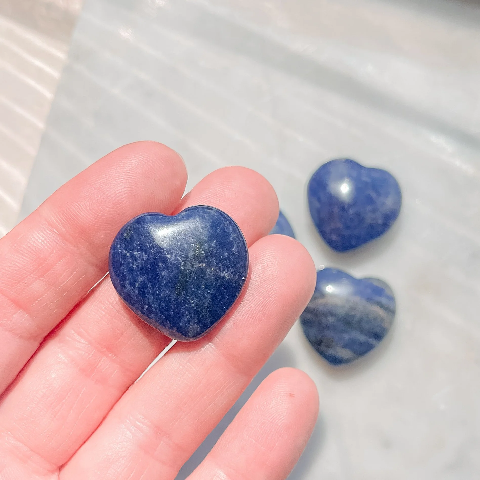 sodalite heart in hand.JPG