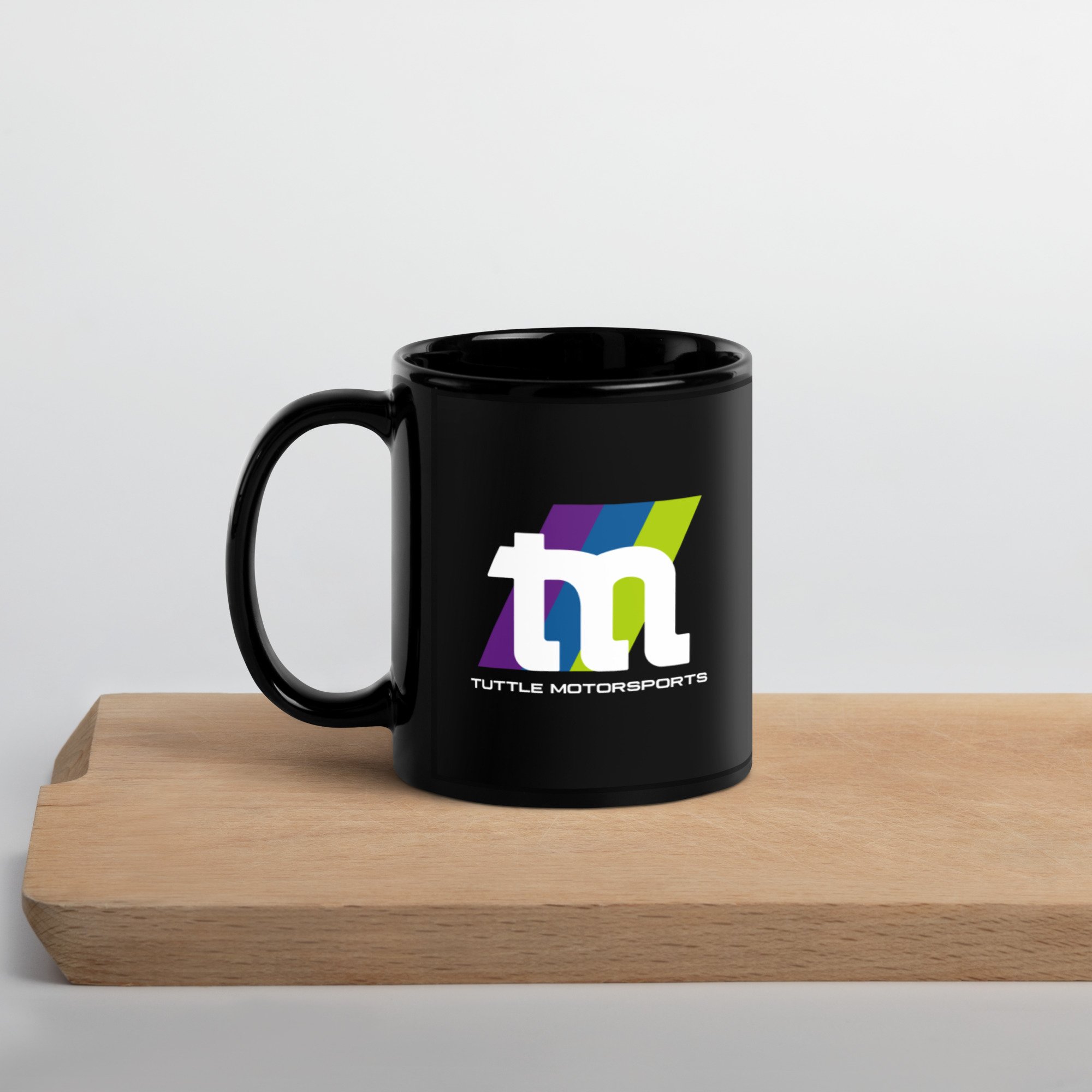 black-glossy-mug-black-11oz-handle-on-left-63c9a9bac11c0.jpg