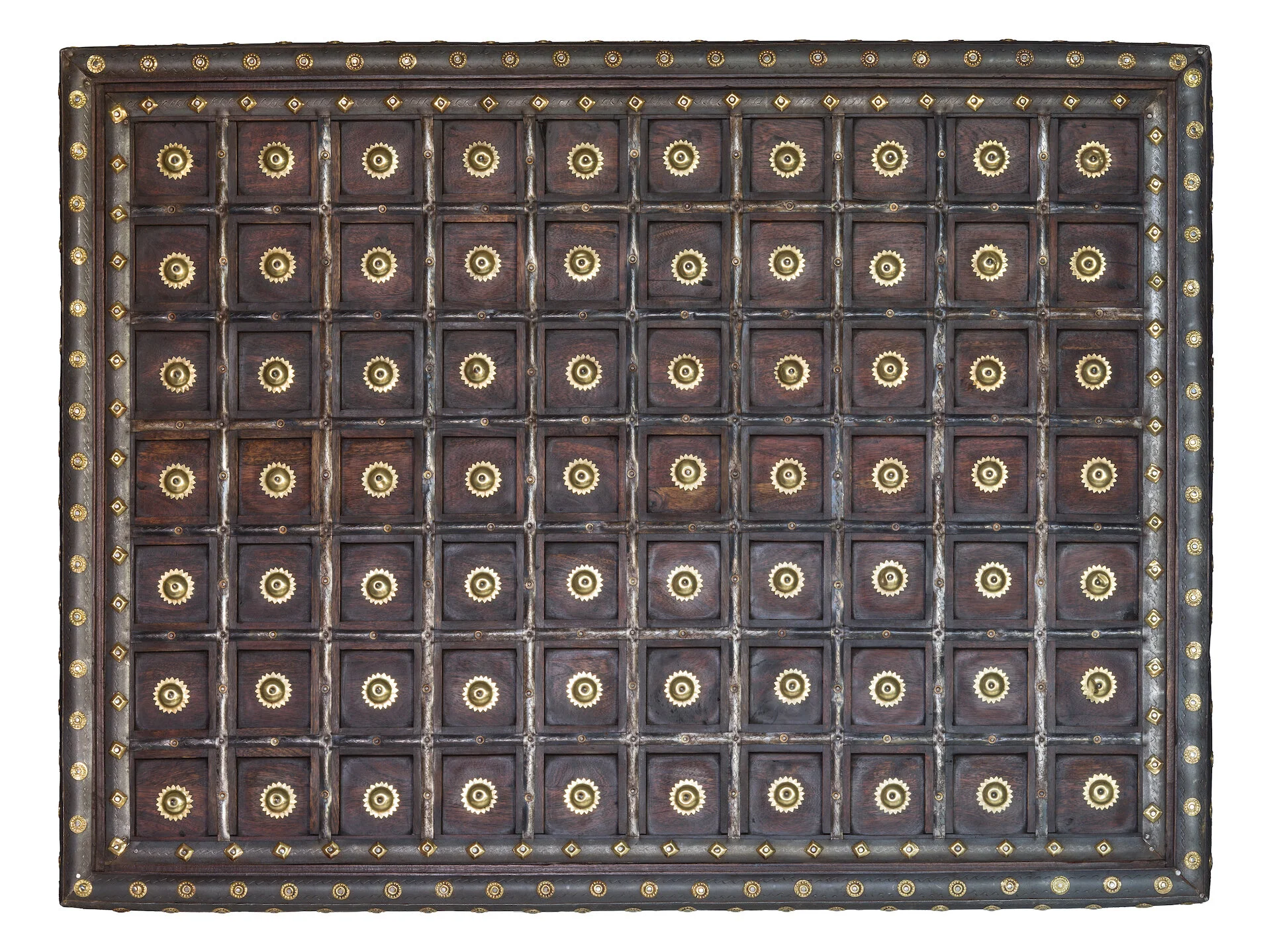 A large, ornate wooden chest with a grid of small drawers, each with a brass handle and decorative brass accents.