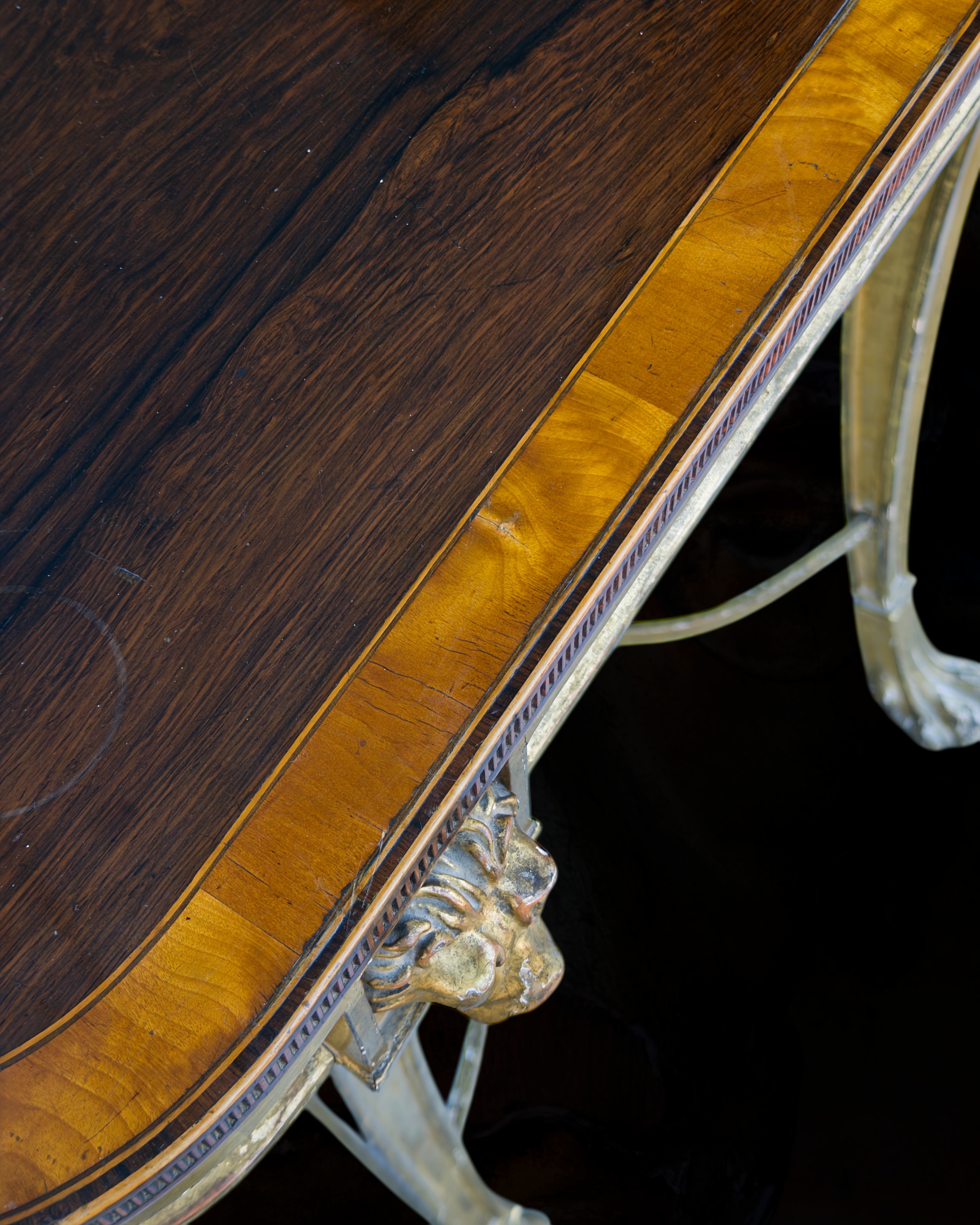 A fine Sheraton carved and gilded consolle table with a top venereed in rosewood and satinwood14.PNG