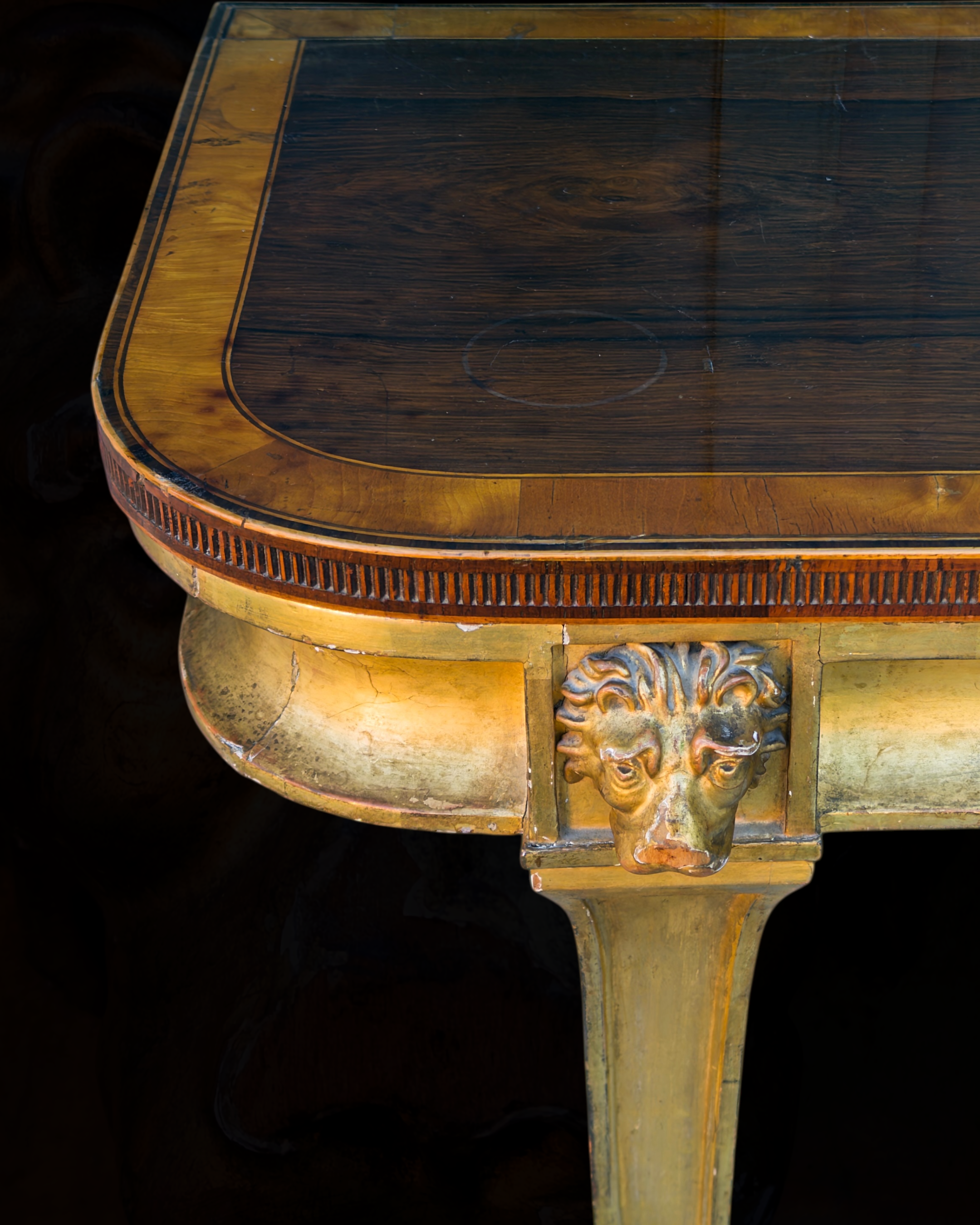 A fine Sheraton carved and gilded consolle table with a top venereed in rosewood and satinwood23.PNG