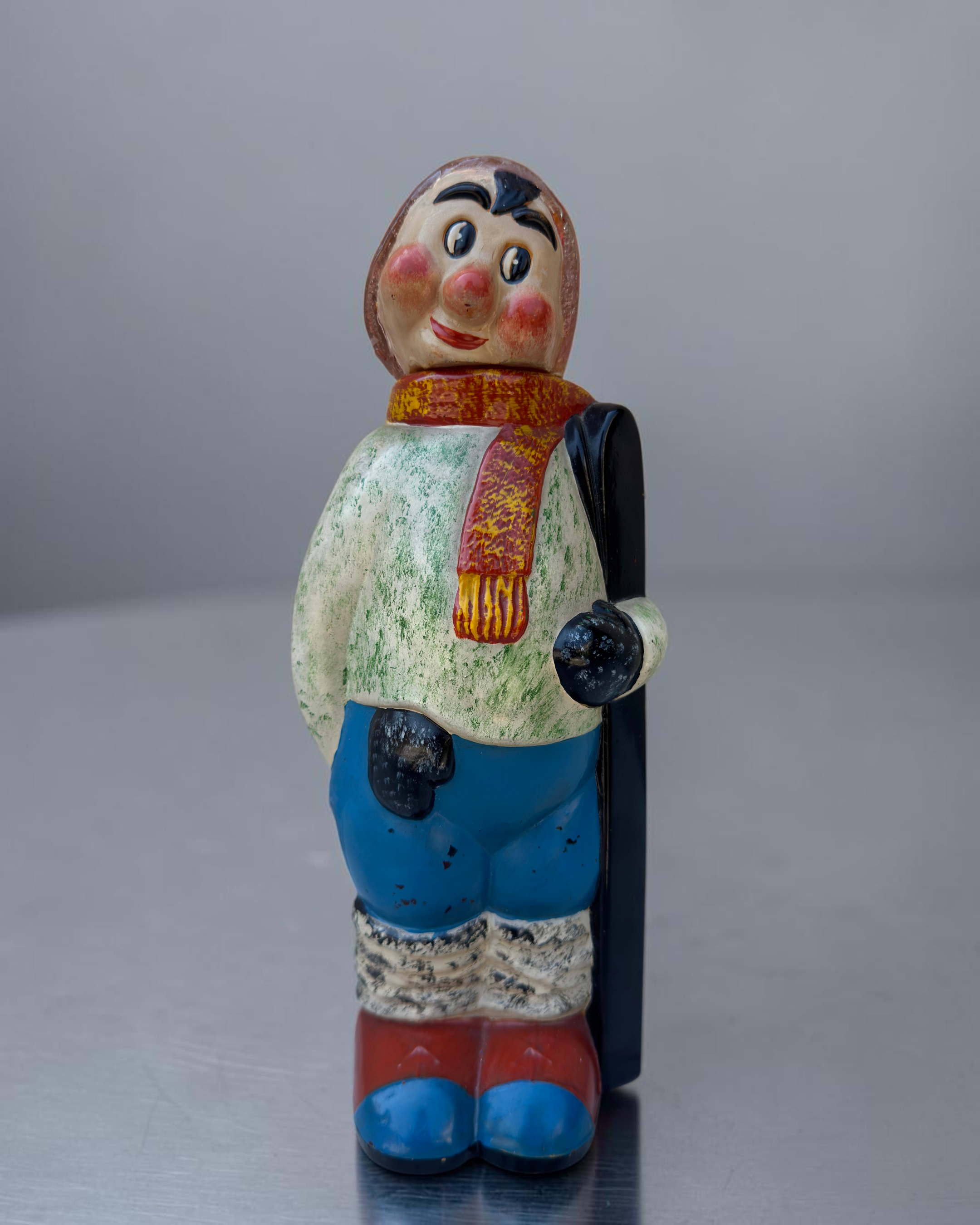A playful glass figural decanter bottle