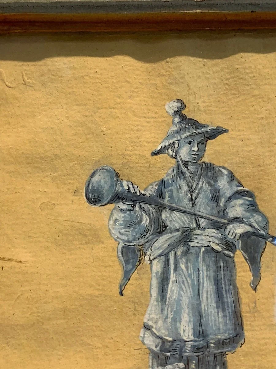 A monochrome illustration of a woman in traditional clothing and a large, pointed hat, holding a trumpet.