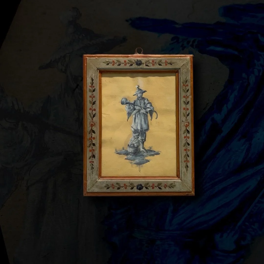 Painting of a soldier in historical uniform holding a rifle, framed with a decorated border, displayed on a dark wall.