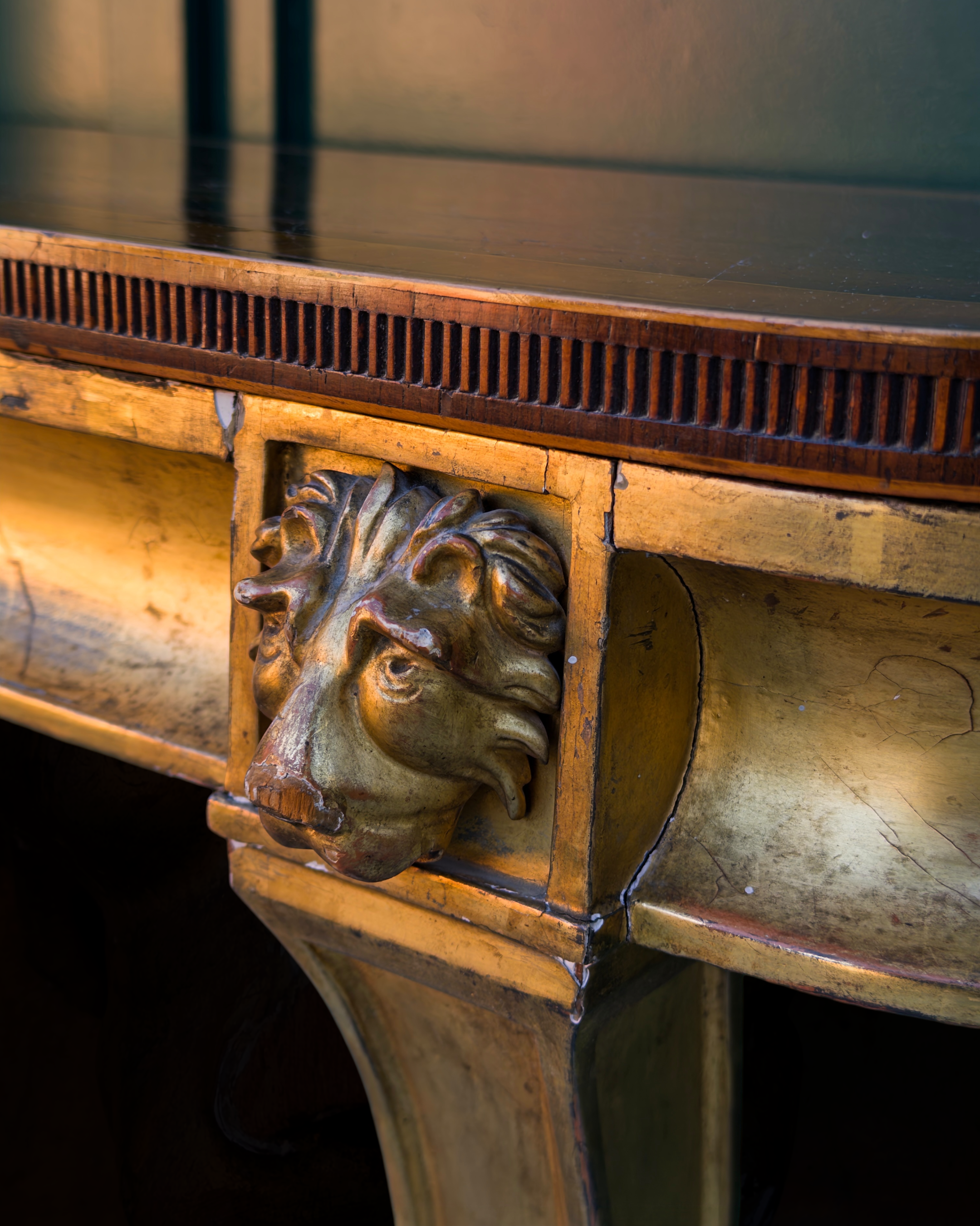 A fine Sheraton carved and gilded consolle table with a top venereed in rosewood and satinwood7.PNG