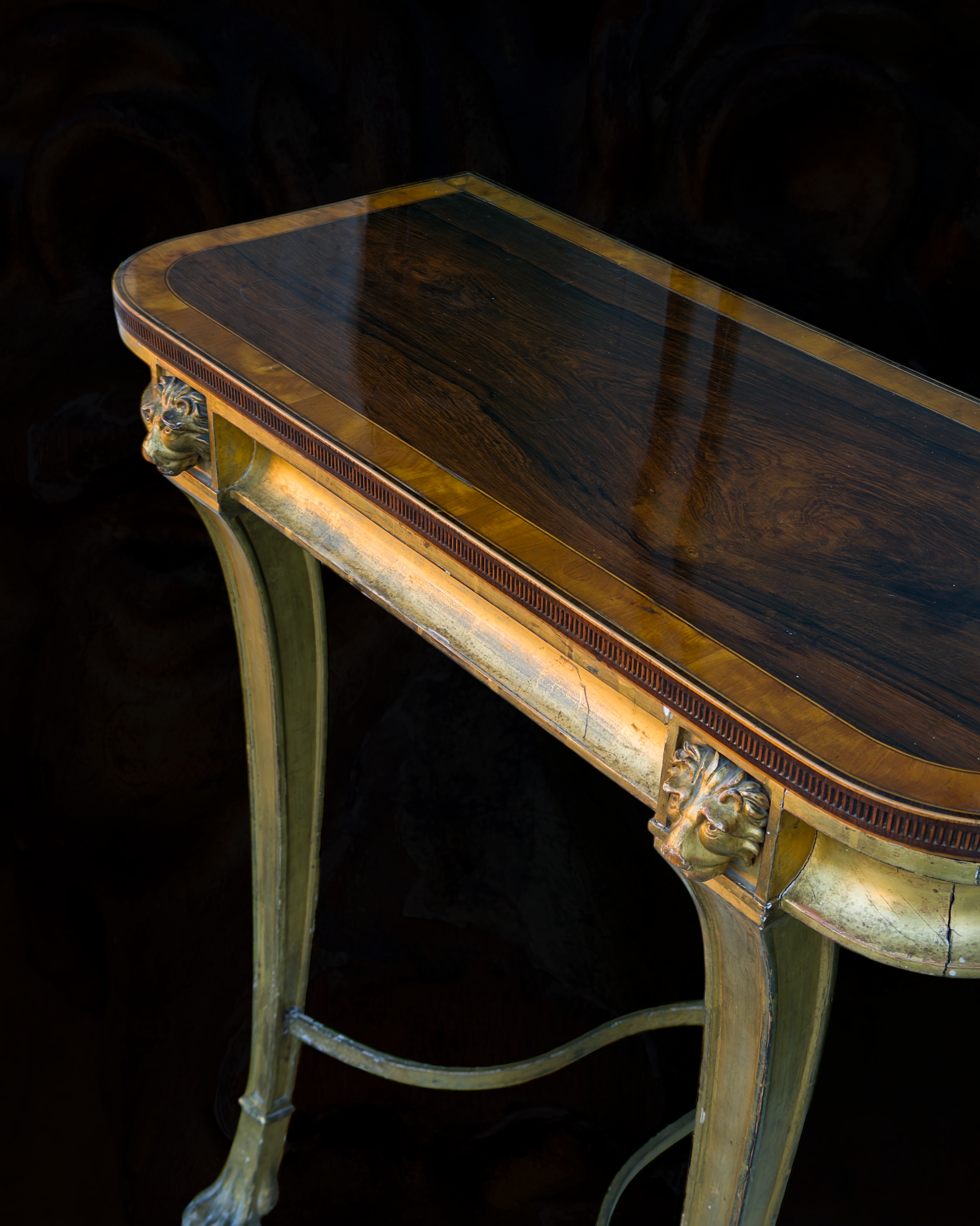 A fine Sheraton carved and gilded consolle table with a top venereed in rosewood and satinwood8.PNG