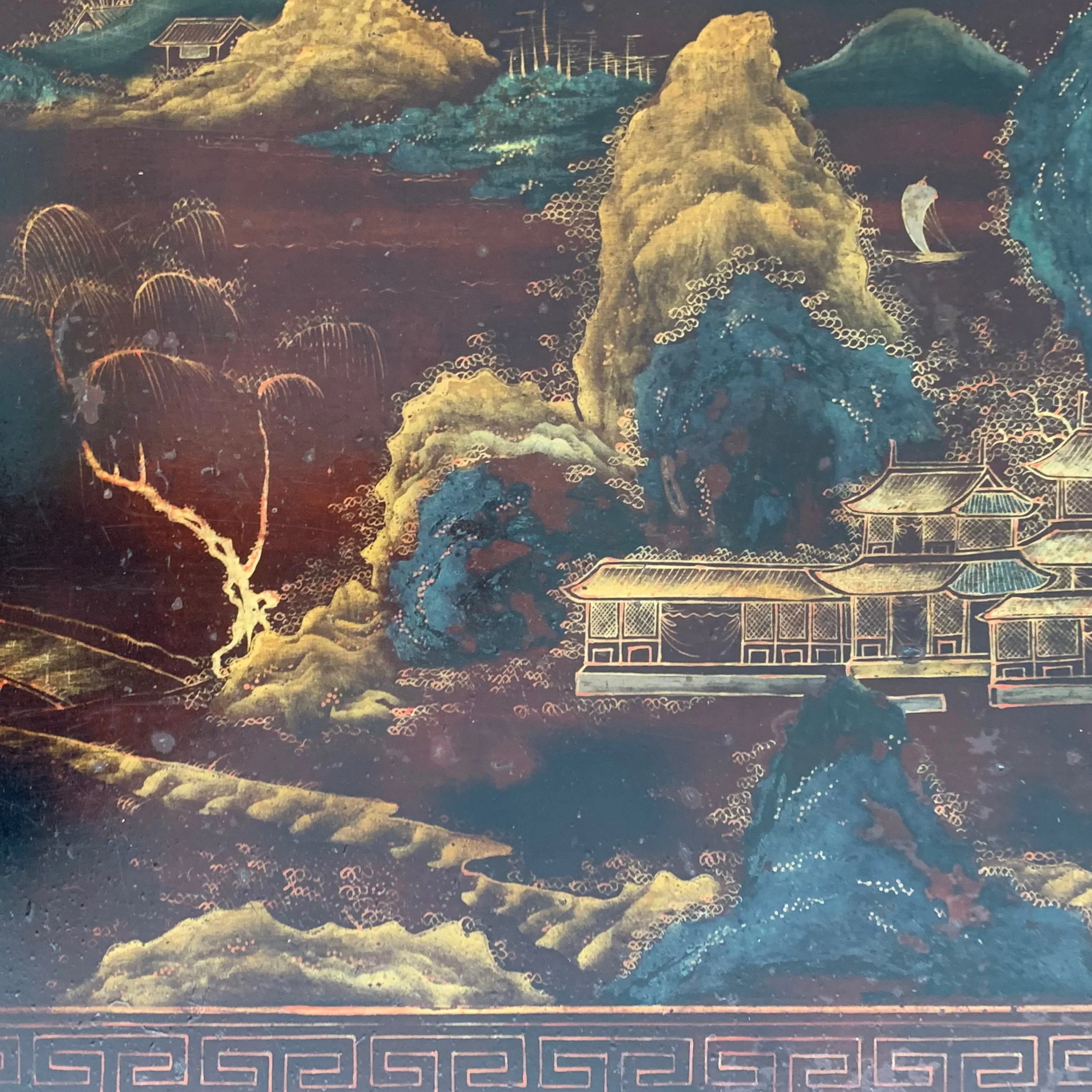 Traditional Chinese landscape painting featuring mountains, trees, a river with a boat, and buildings with curved roofs.