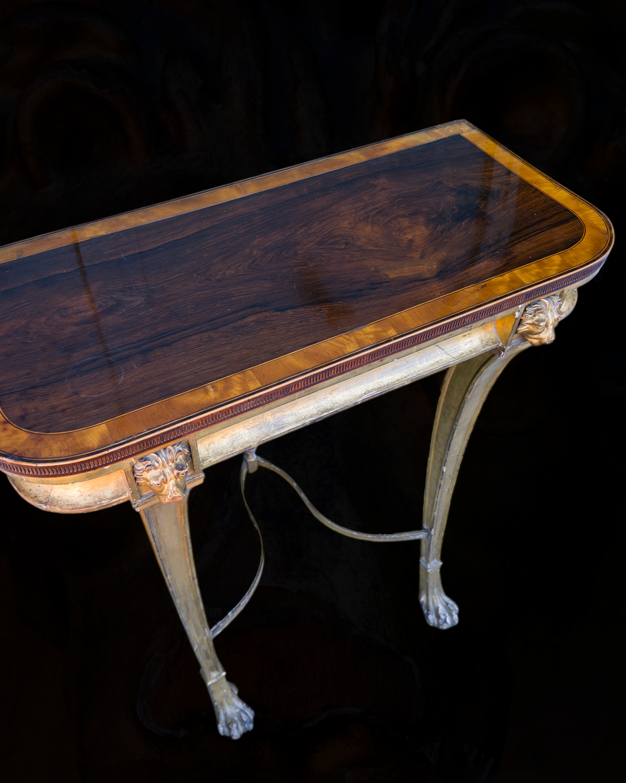A fine Sheraton carved and gilded consolle table with a top venereed in rosewood and satinwood11.PNG