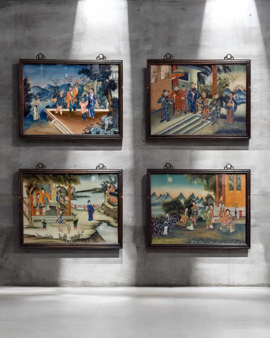 Set of four reverse glass paintings depicting lively Chinese genre scenes