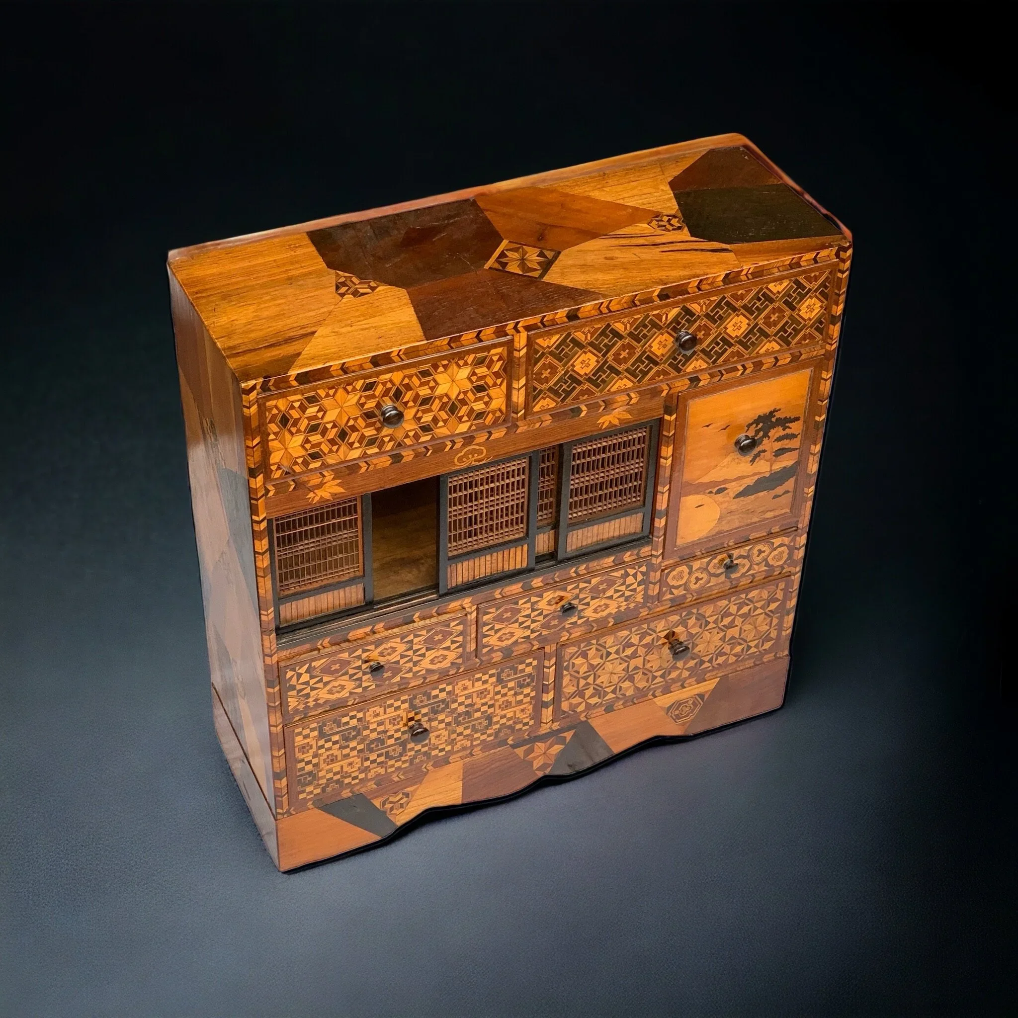 SOLD: Cabinet finely venereed in precious woods
