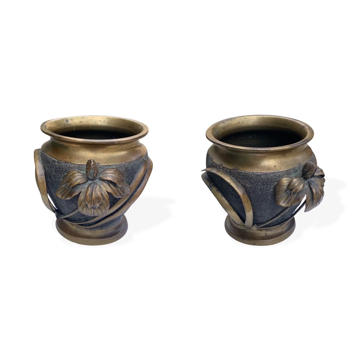 Two decorative vases with dark bodies, gold rims, and detailed floral and leaf embellishments, placed against a white background.