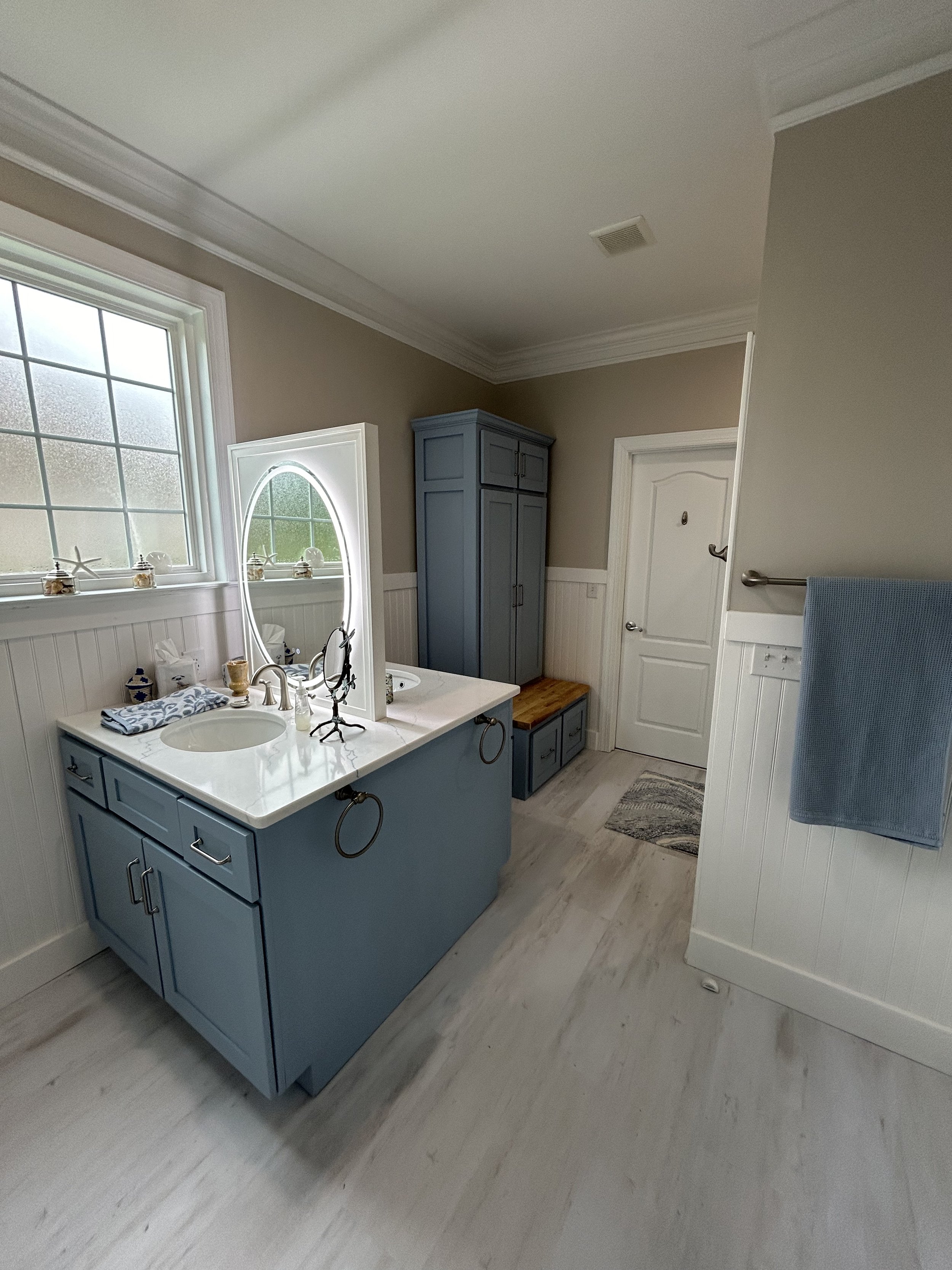 The Linen Cabinet in the corner was inspired by a Pinterest post and built by a local master cabinet maker.
