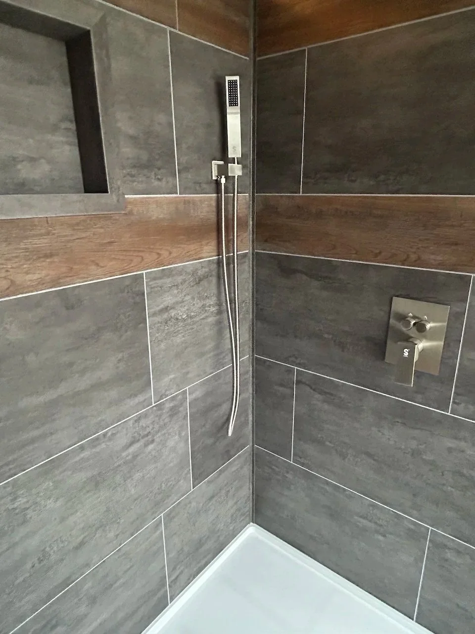 Grout-free, vinyl tiles also have accent planks.