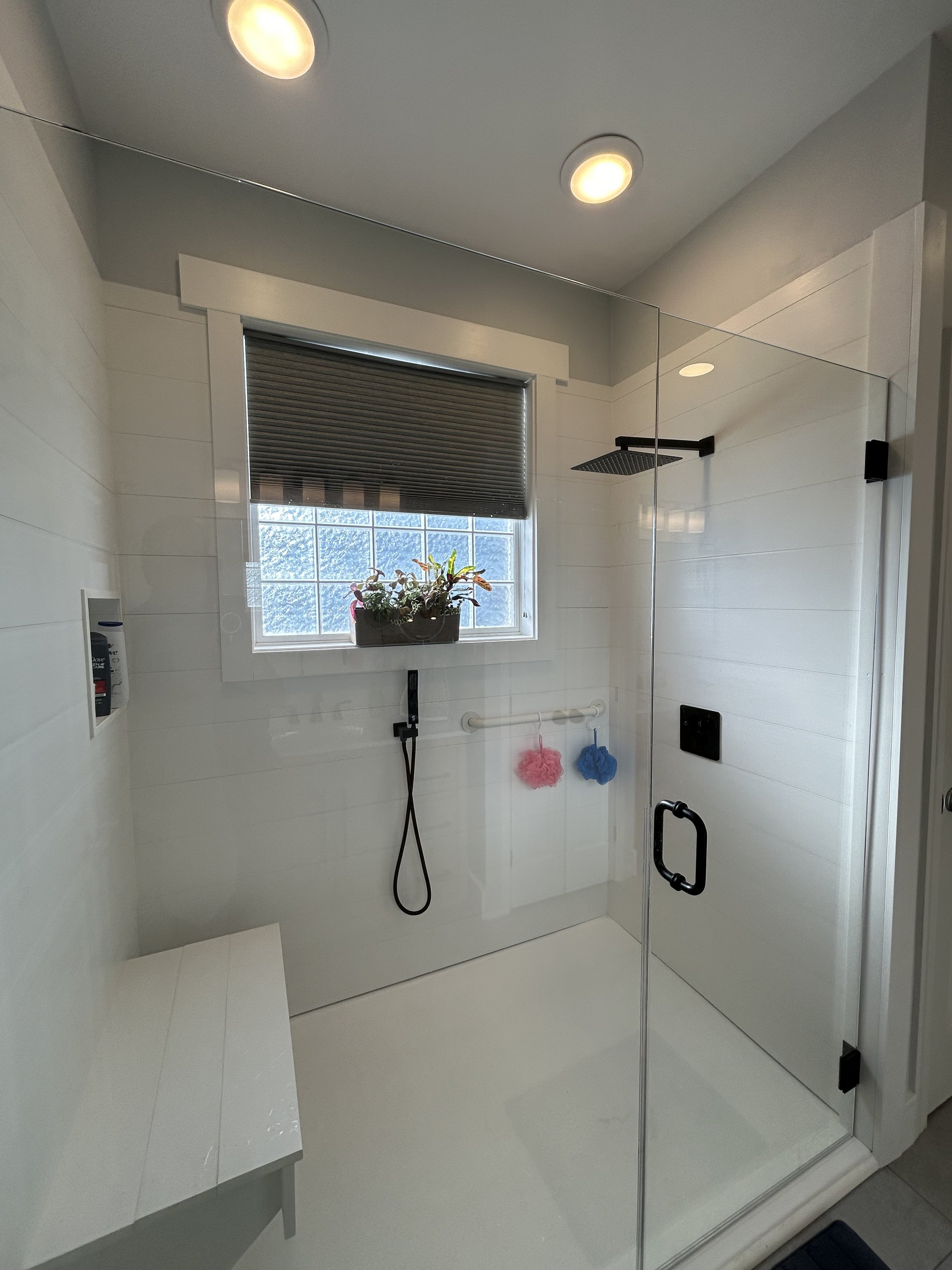 This client wanted a permanent seat in the shower. We replace existing window trim with pvc trim boards.