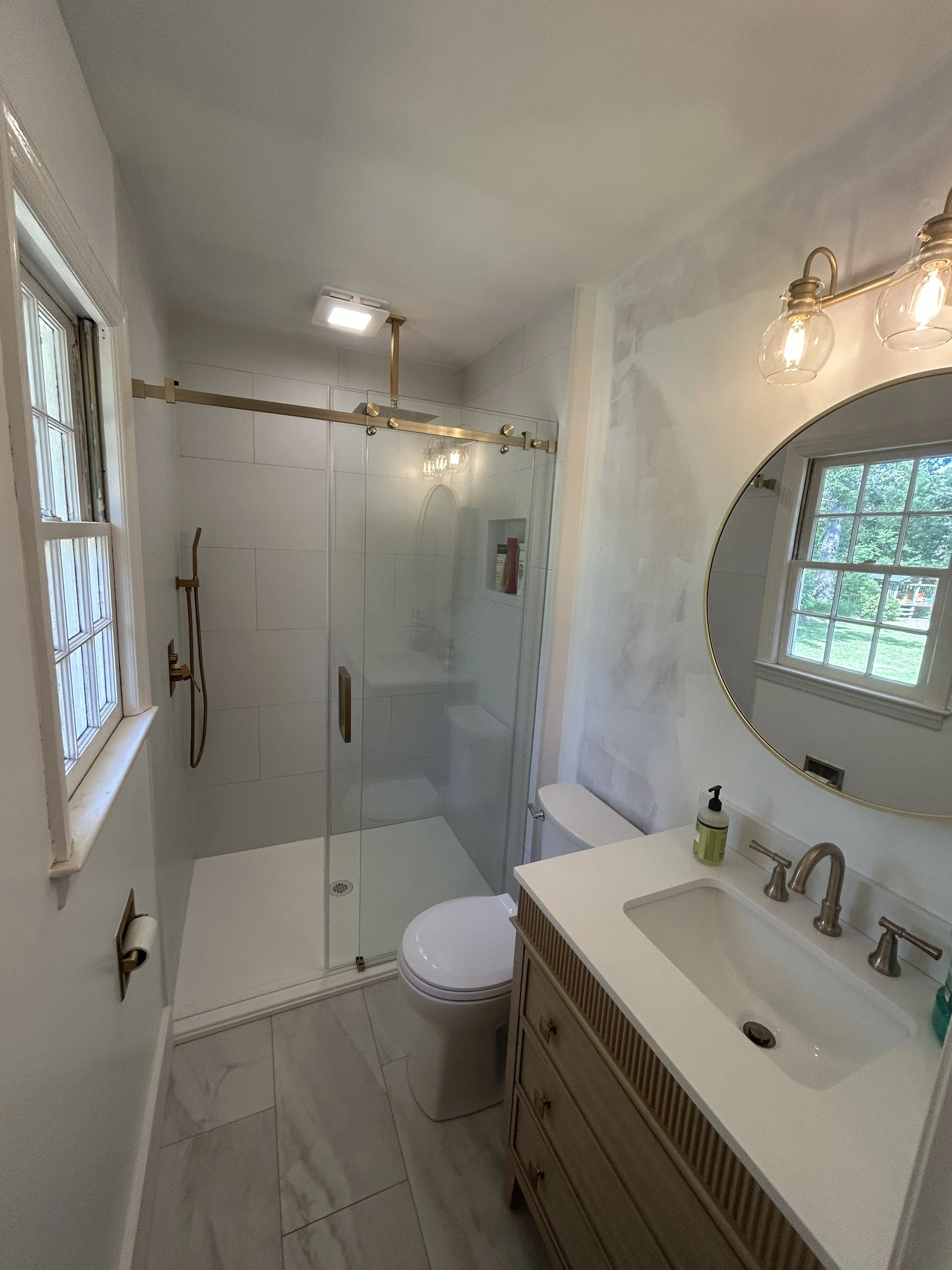 Replacing a small fiberglass shower unit with a custom-built shower will yield a much larger showering space.