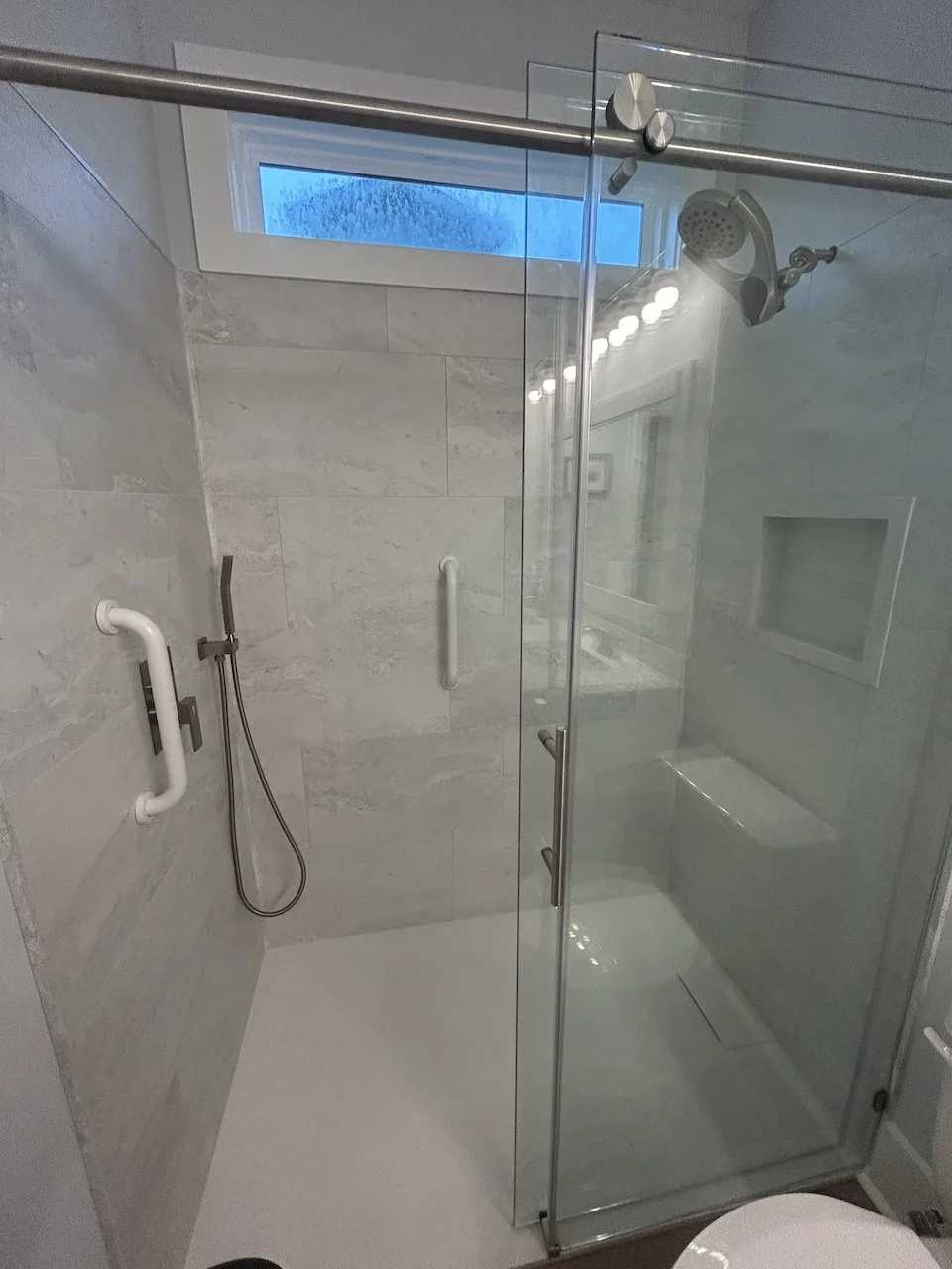 Note the hidden drain in the shower base.