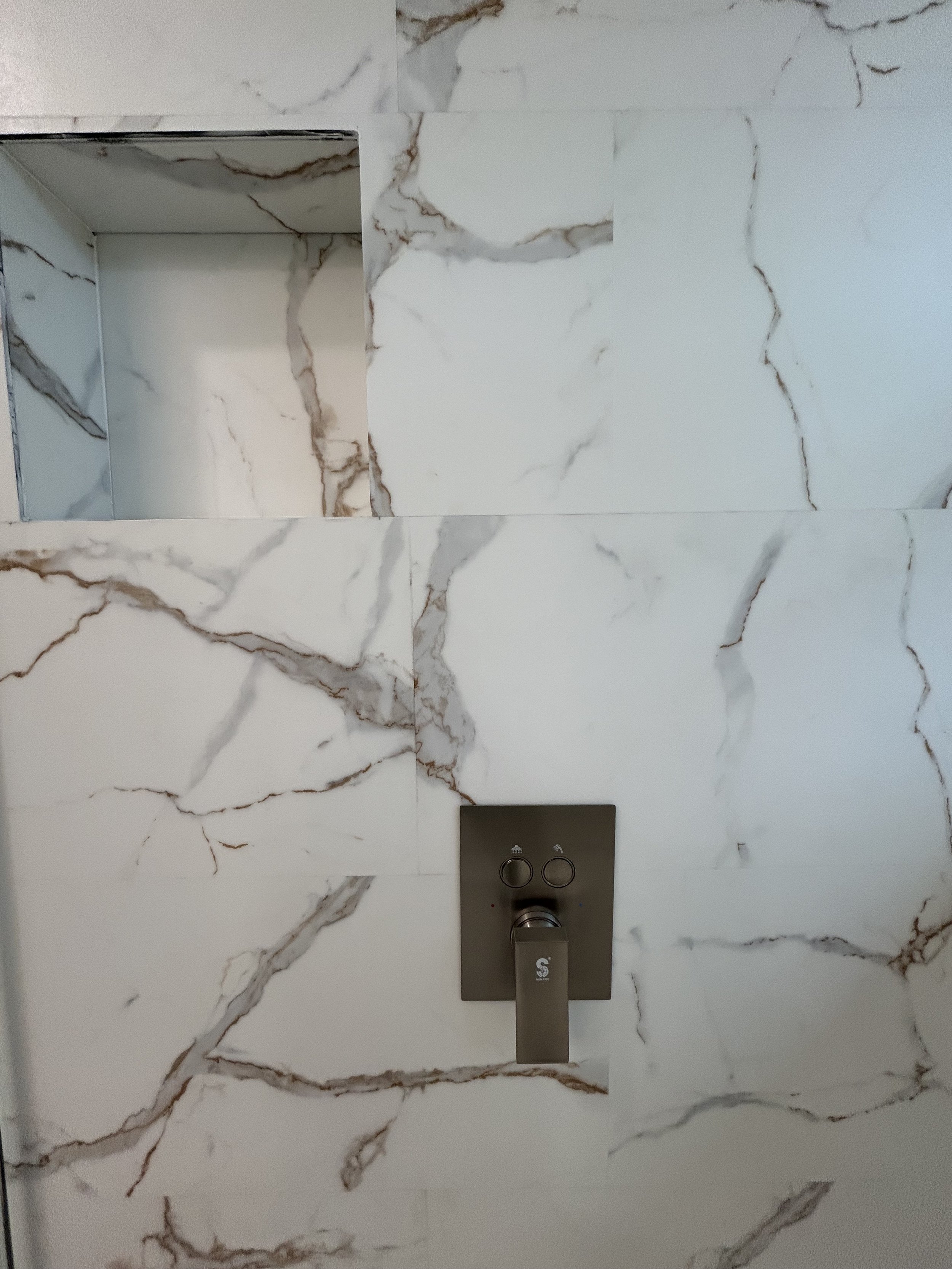 We locate shower controls so you stay dry when turning on the water
