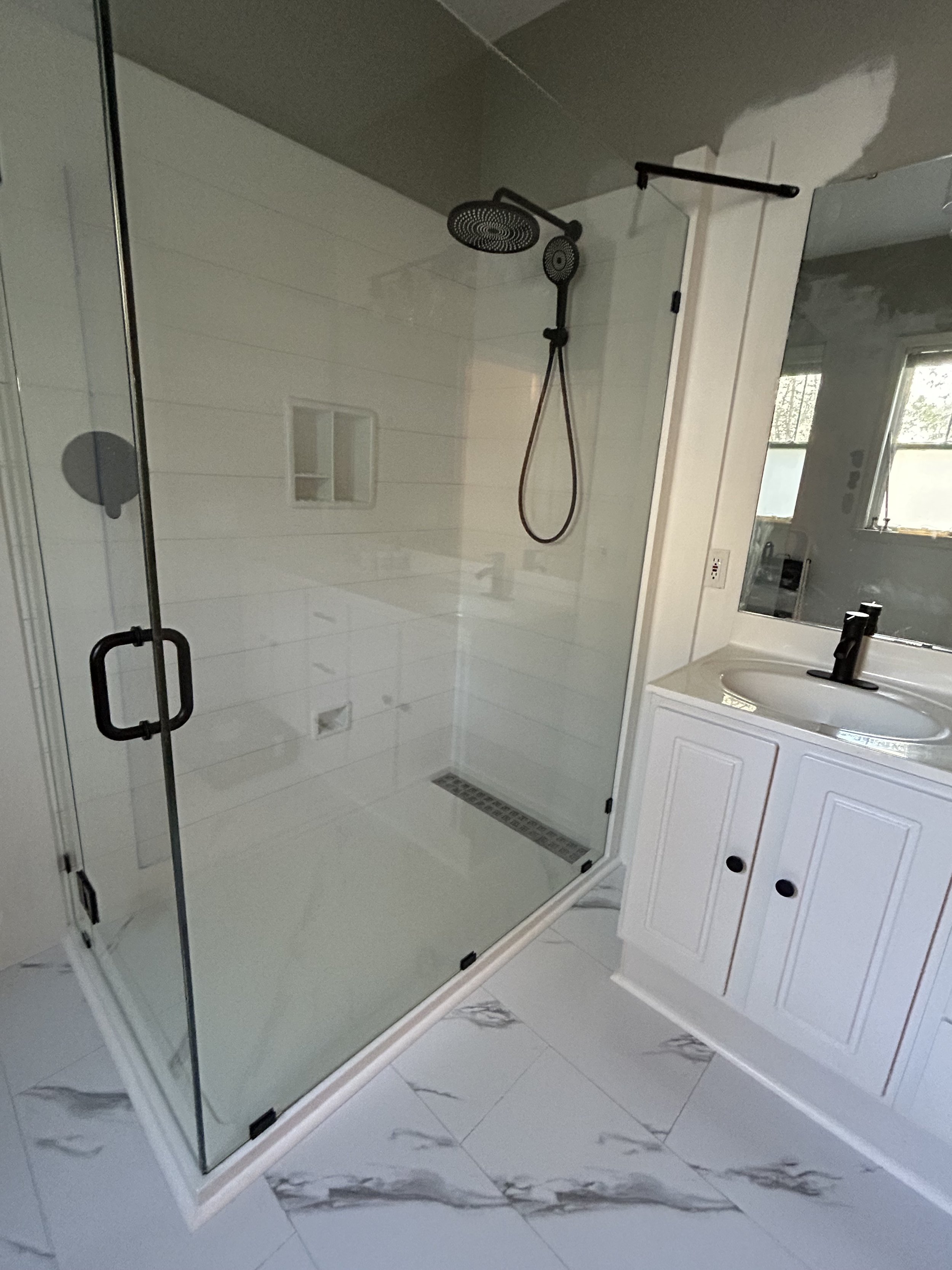 They traded a seldom-used jacuzzi tub for a large walk-in shower that's used daily