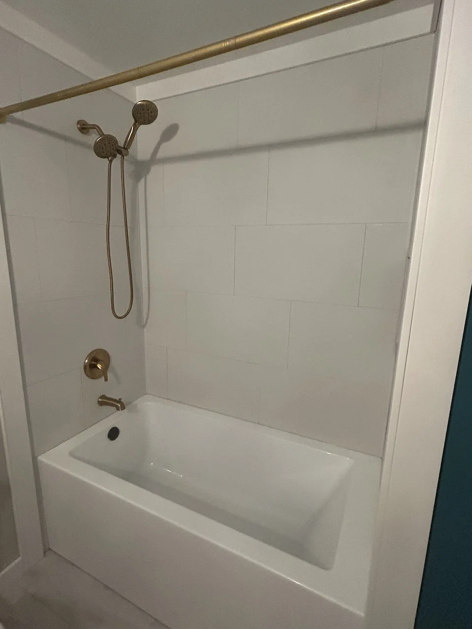 Grout-free, vinyl tile above the new tub is a must where a bathtub is required.