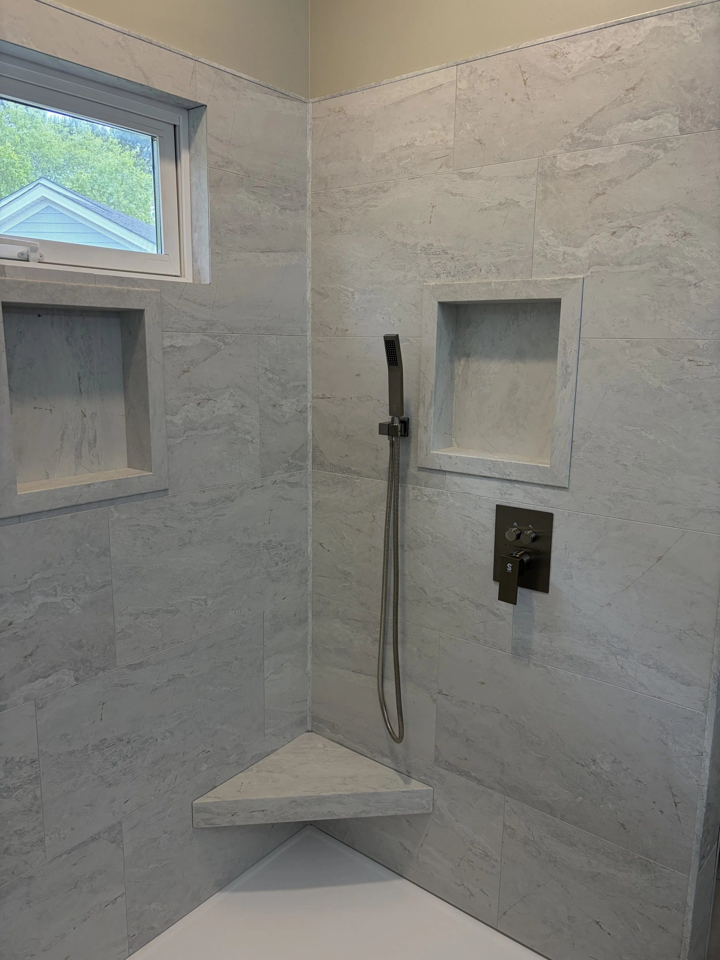 We locate recessed niches, benches, and shelves according to your personal preferences