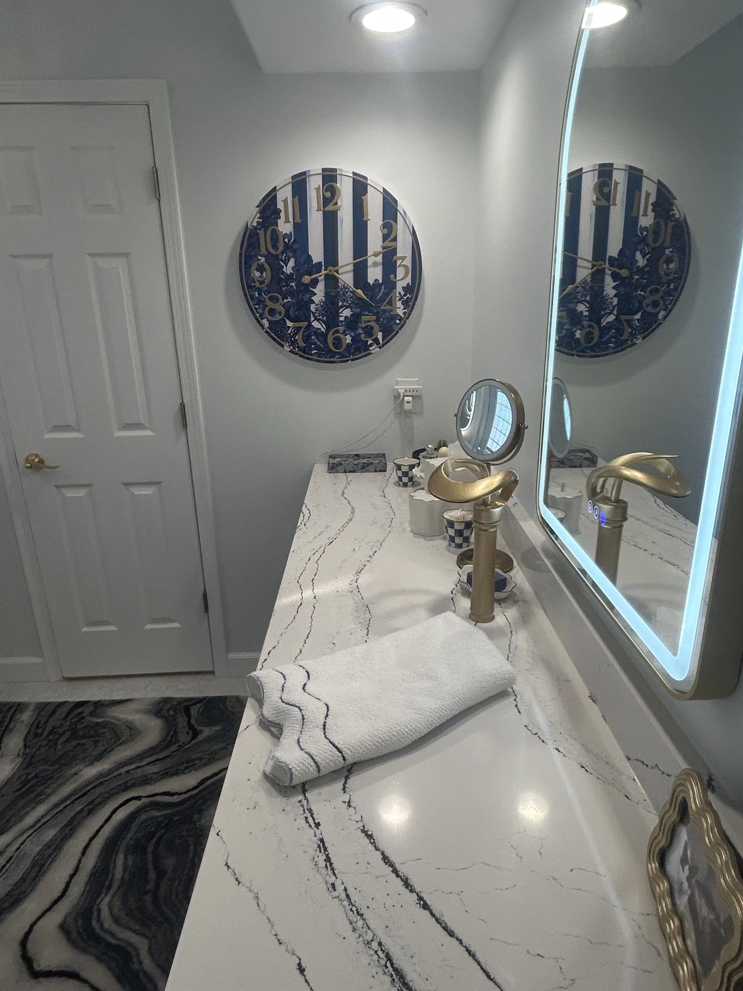 This door was formerly a shower door and now opens to a large linen closet.