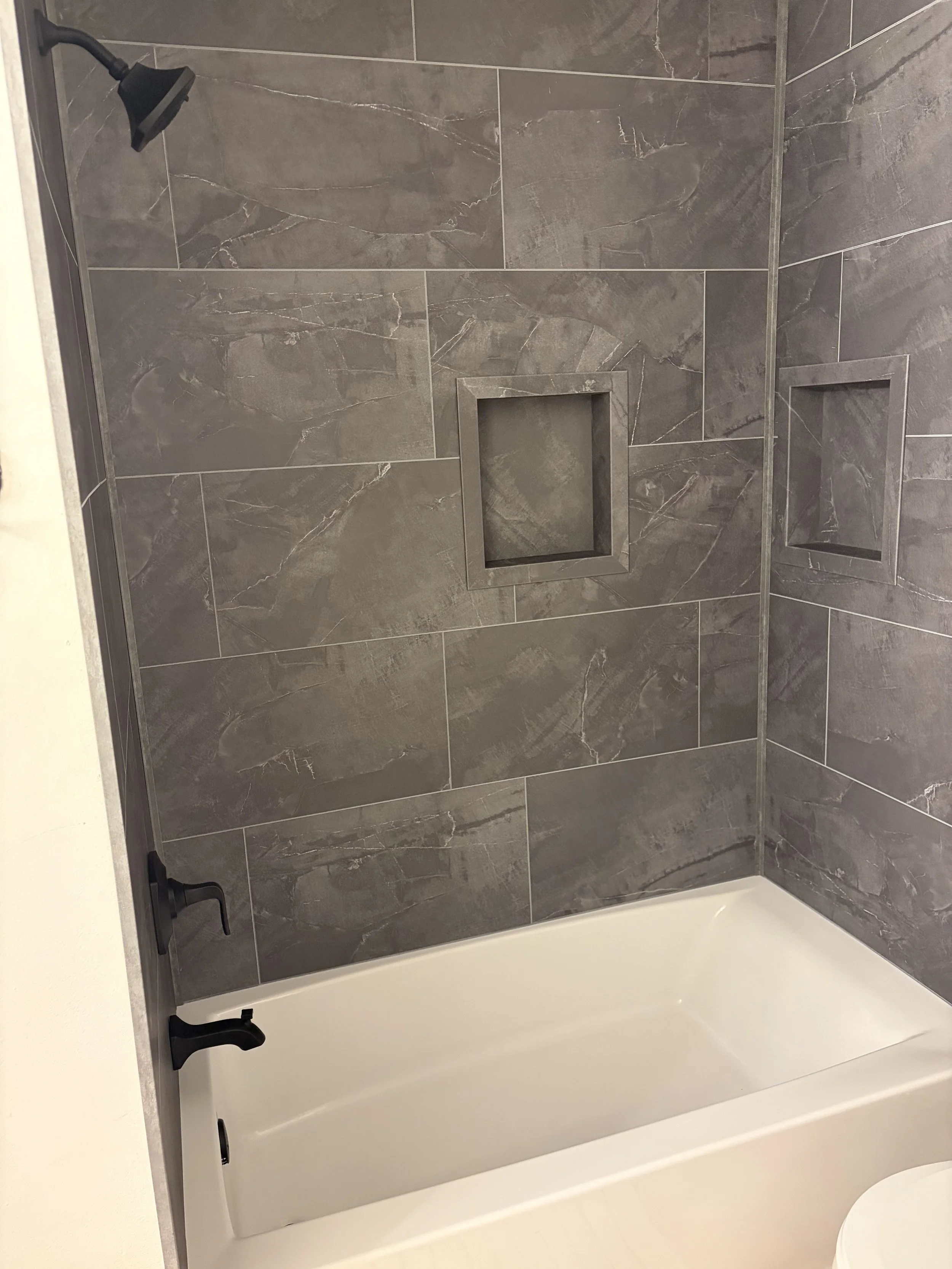 New or existing tubs can be easily up-fitted with grout-free tile