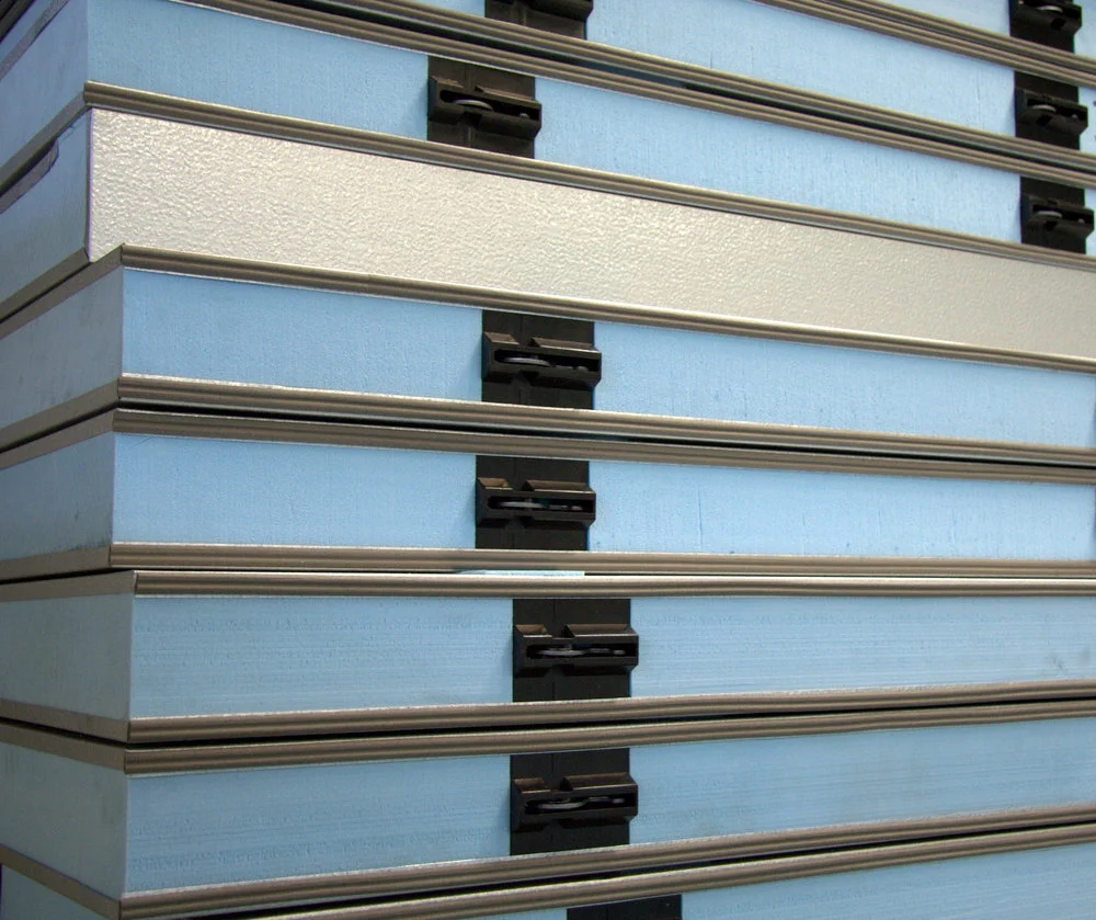 Stacked blue filing cabinets with black handles and metallic trim.