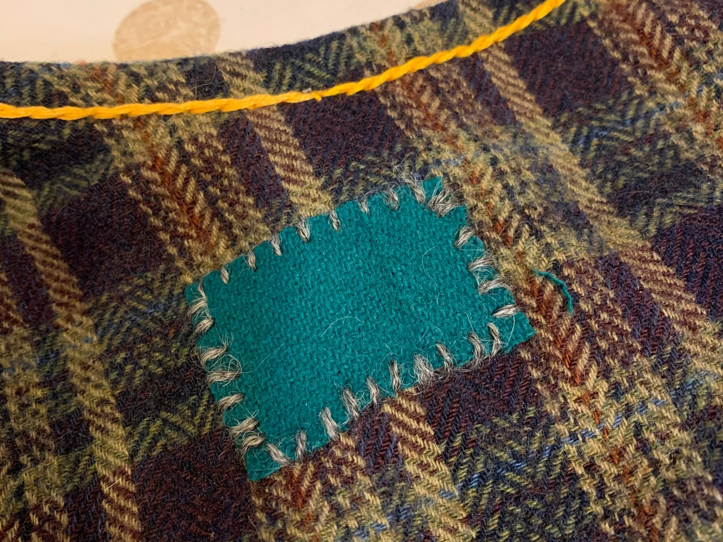 this was sewn with the small amount of Gotland thread I made, before i decided it wasn't worth the aching fingers from pulling the fiber apart.