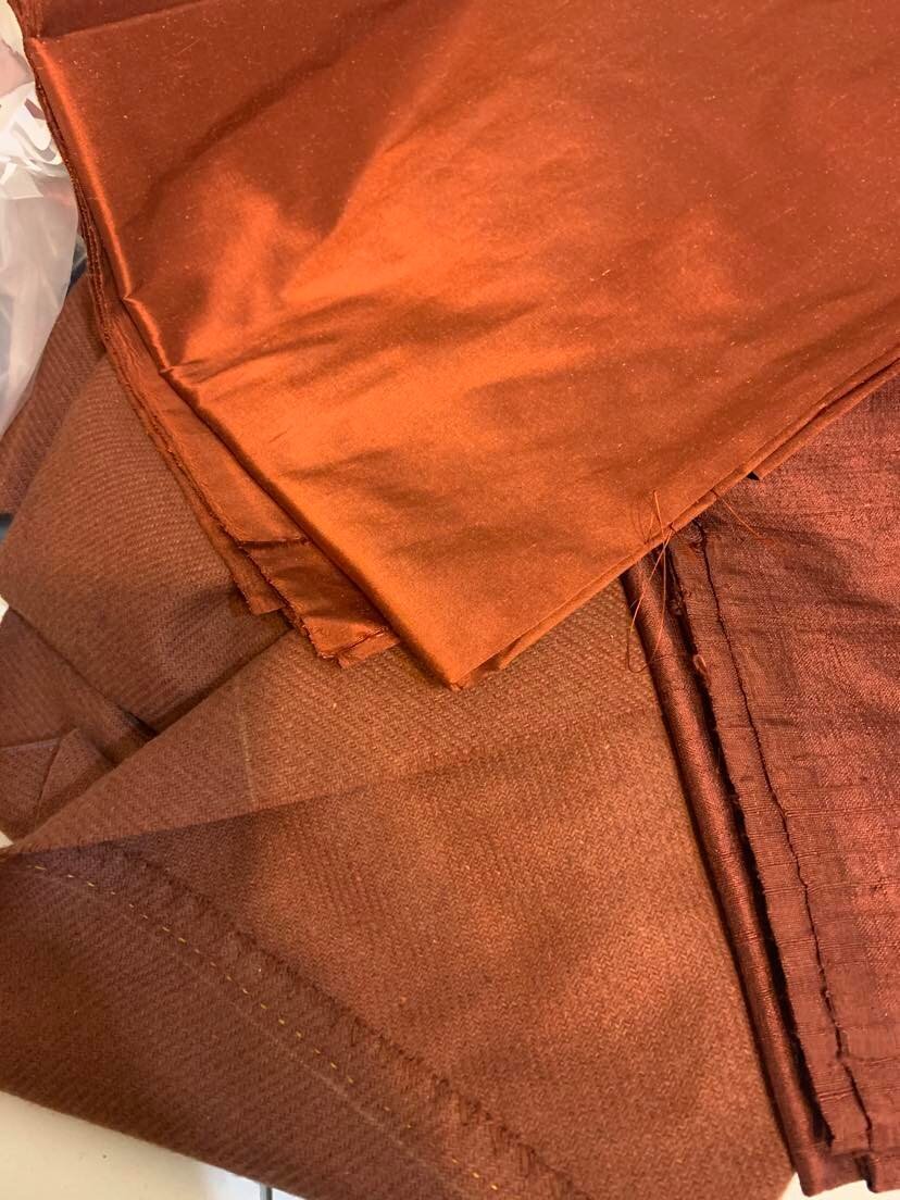 the gingerbread silk on the right might have looked nice, too, but the brandy (deep orange) really pops against the wool. taffeta is smoother and easier to work with than dupioni, too.