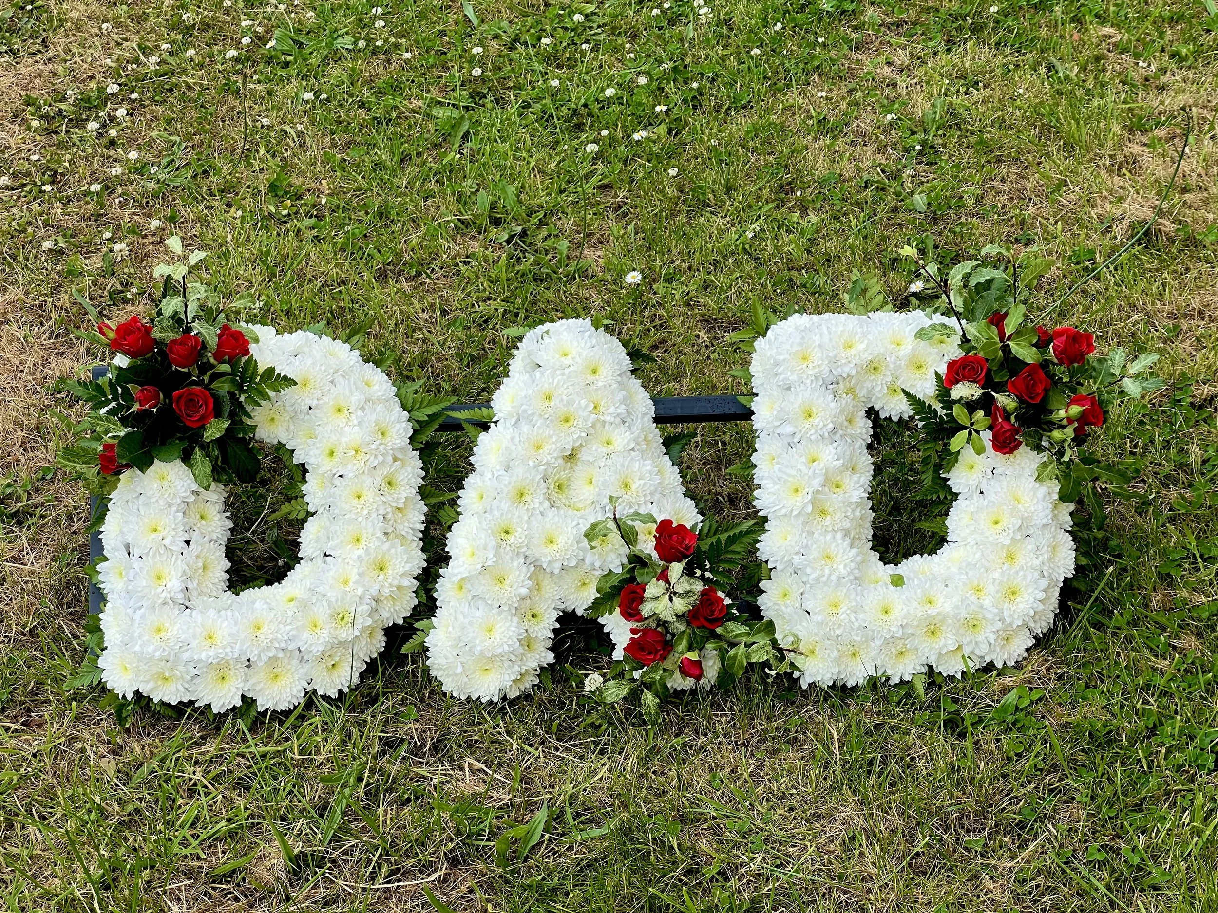 white and red funeral tribute