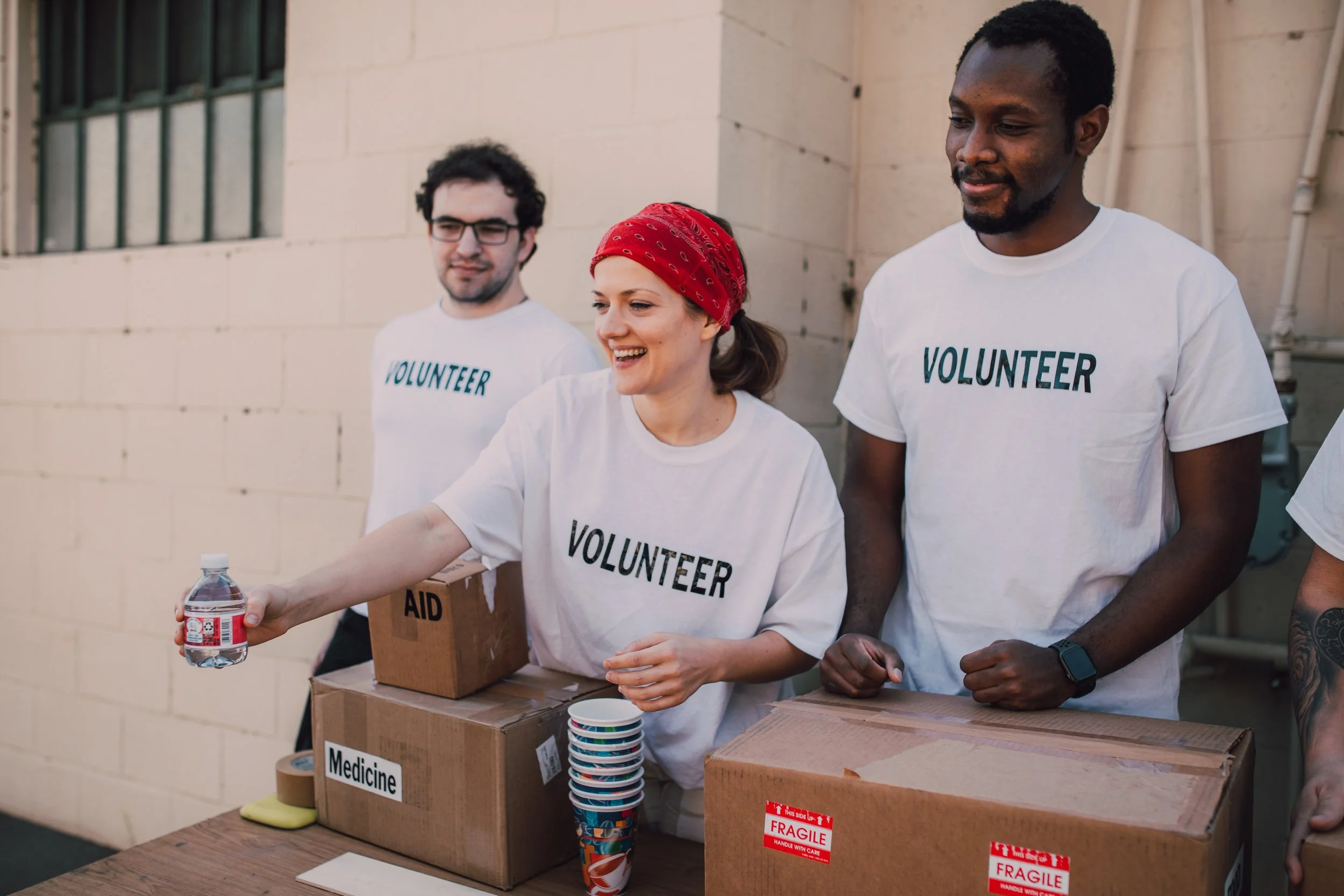 People volunteering at a food drive