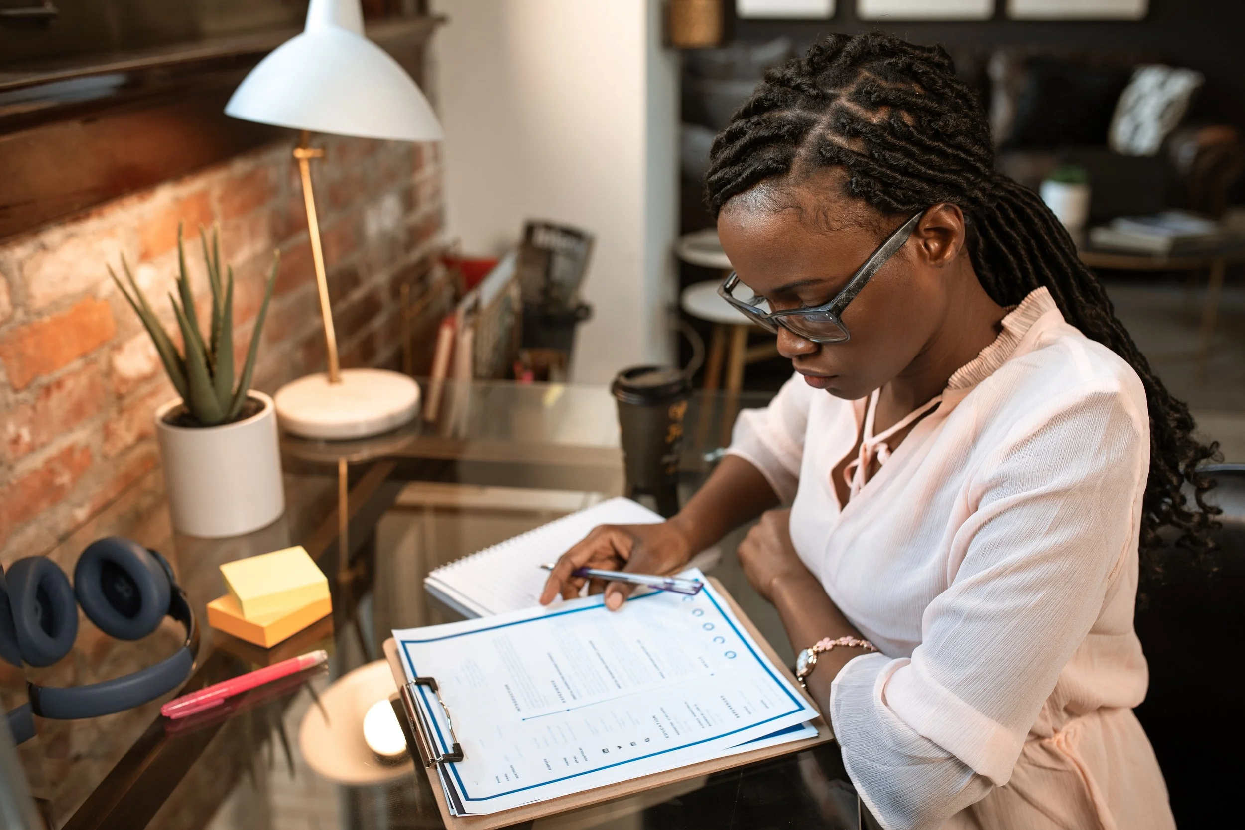 Woman writing financial goals