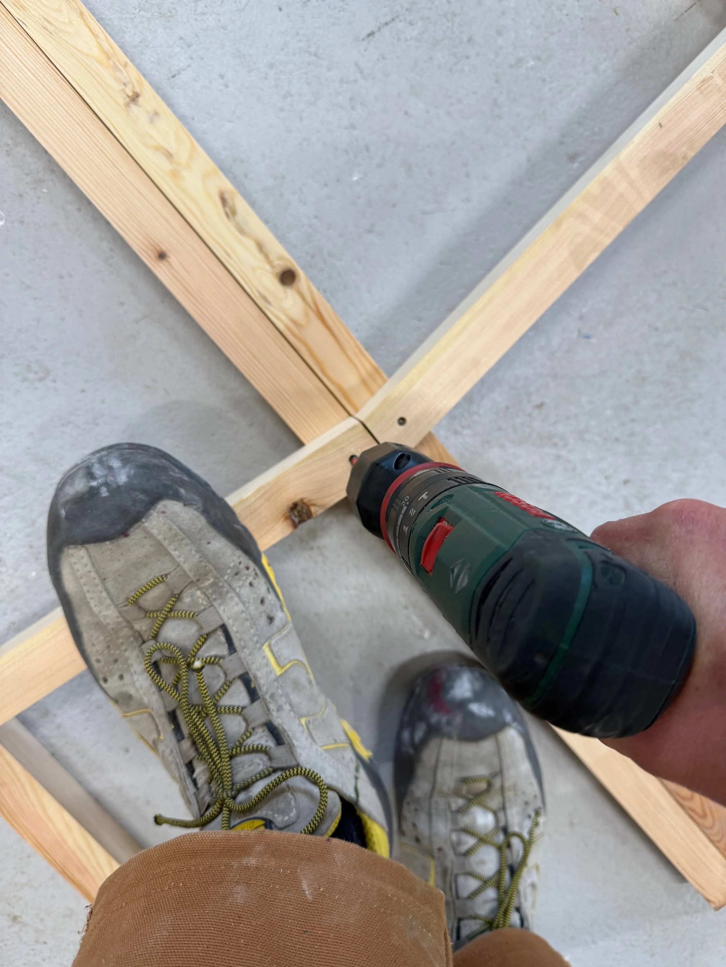 Building trellises for flower support in the municipality's carpentry