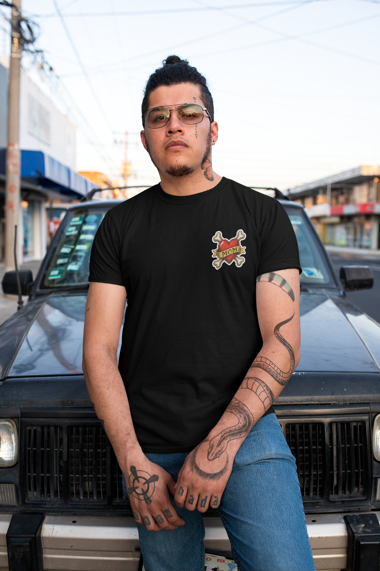 lifestyle-mockup-front-black-of-a-tattooed-man-wearing-porrkchop-cartel-tattooed-frenchie-mom-heart.png