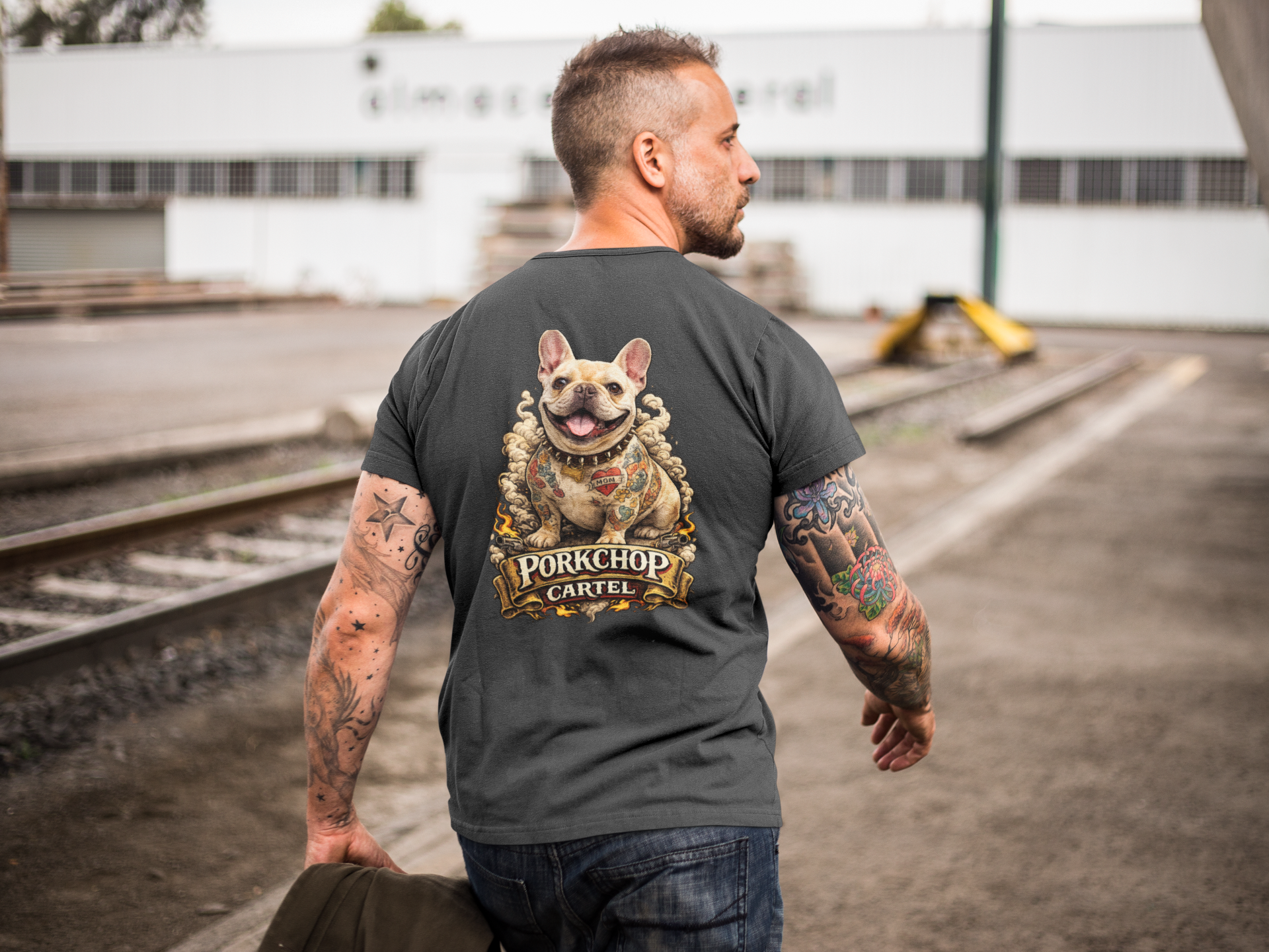 back-lifestyle-mockup-dark-heather-grey-tshirt-man-wearing-porkchop-cartel-tattooed-frenchie-with-mom-heart.png