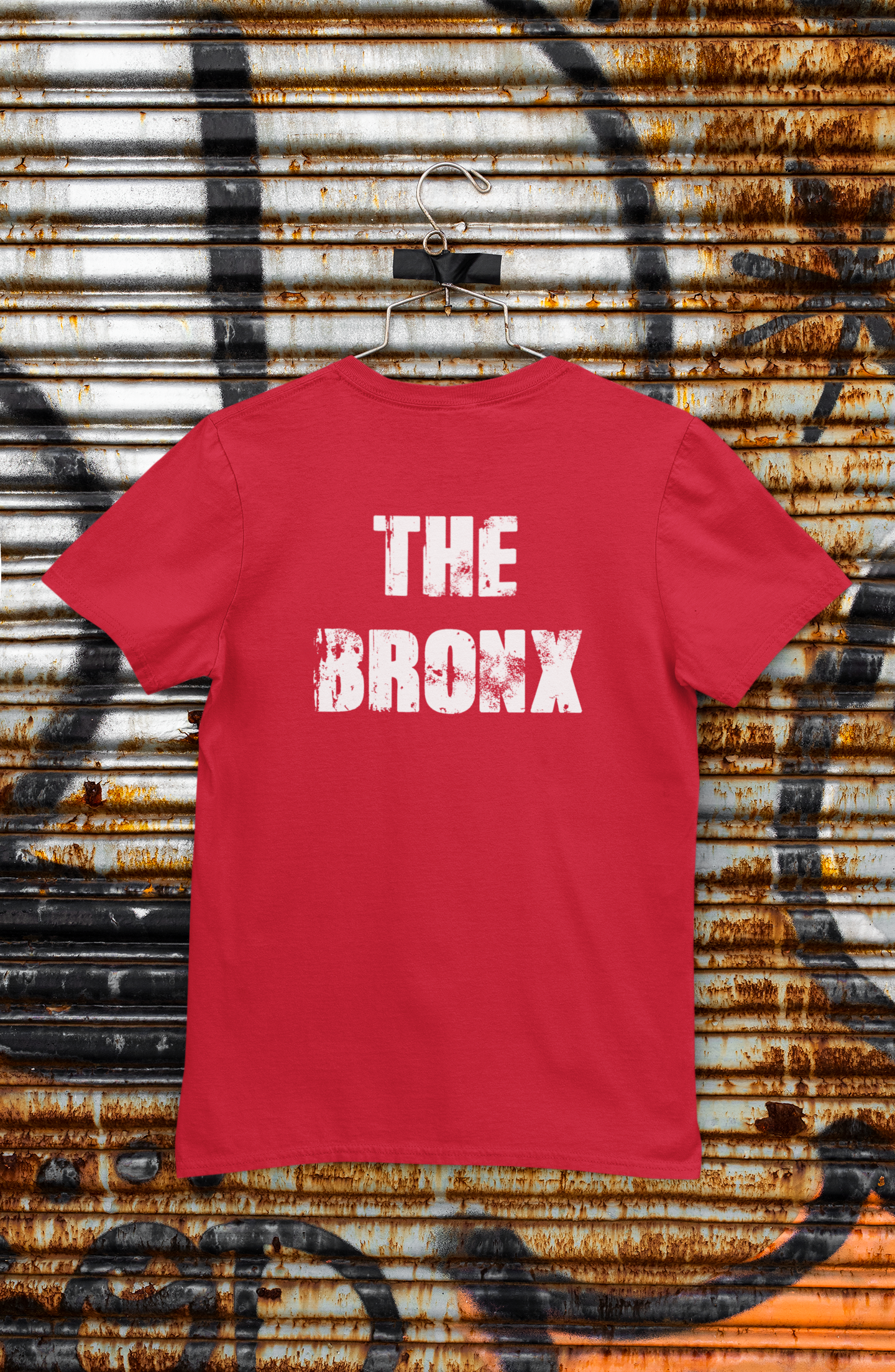 back-view-mockup-of-a-t-shirt-hanged-on-a-rusty-steel-shutter-m453.png