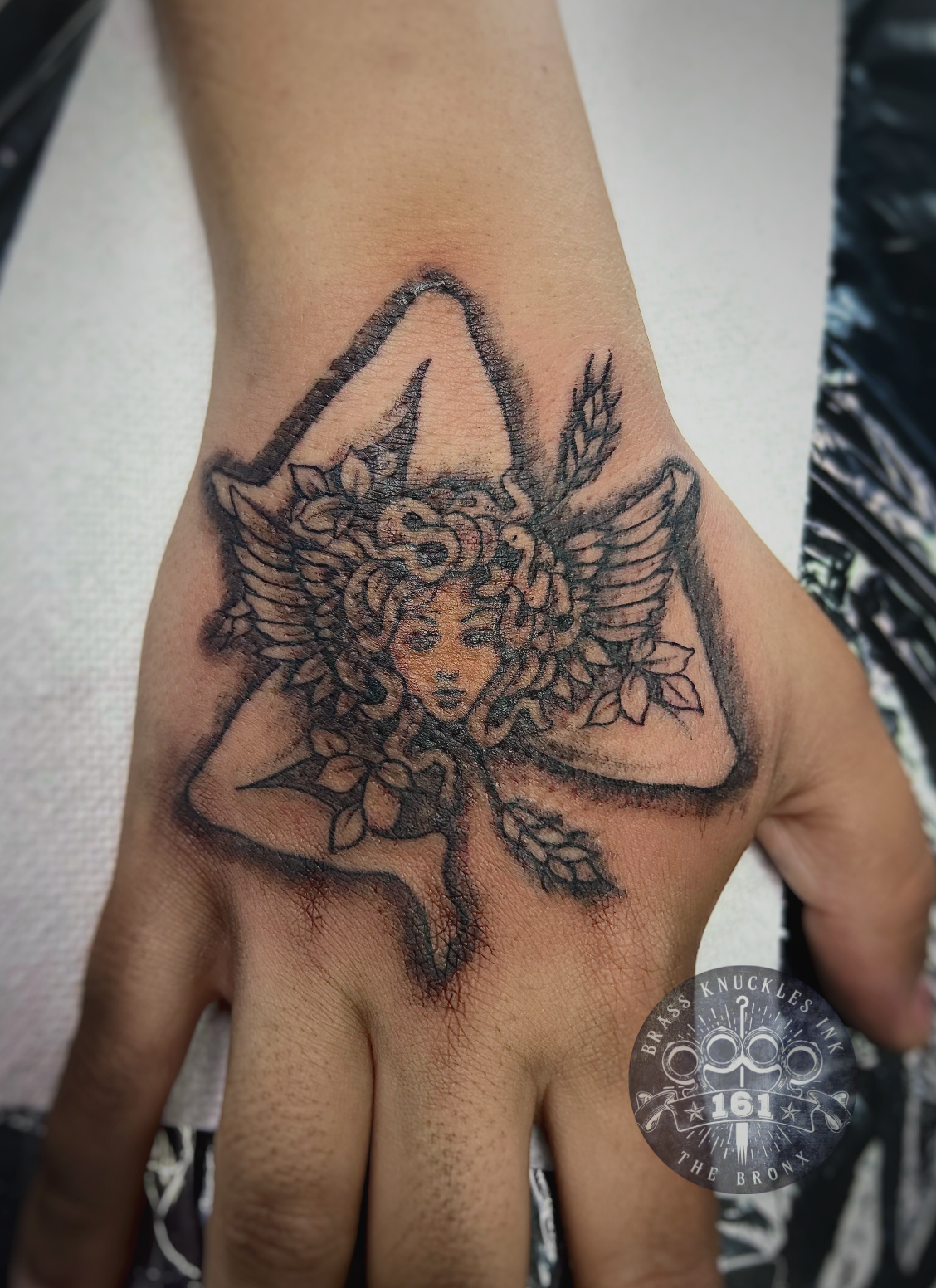 angel-hand-tattoo-black-grey-linework-bronx-nyc.png