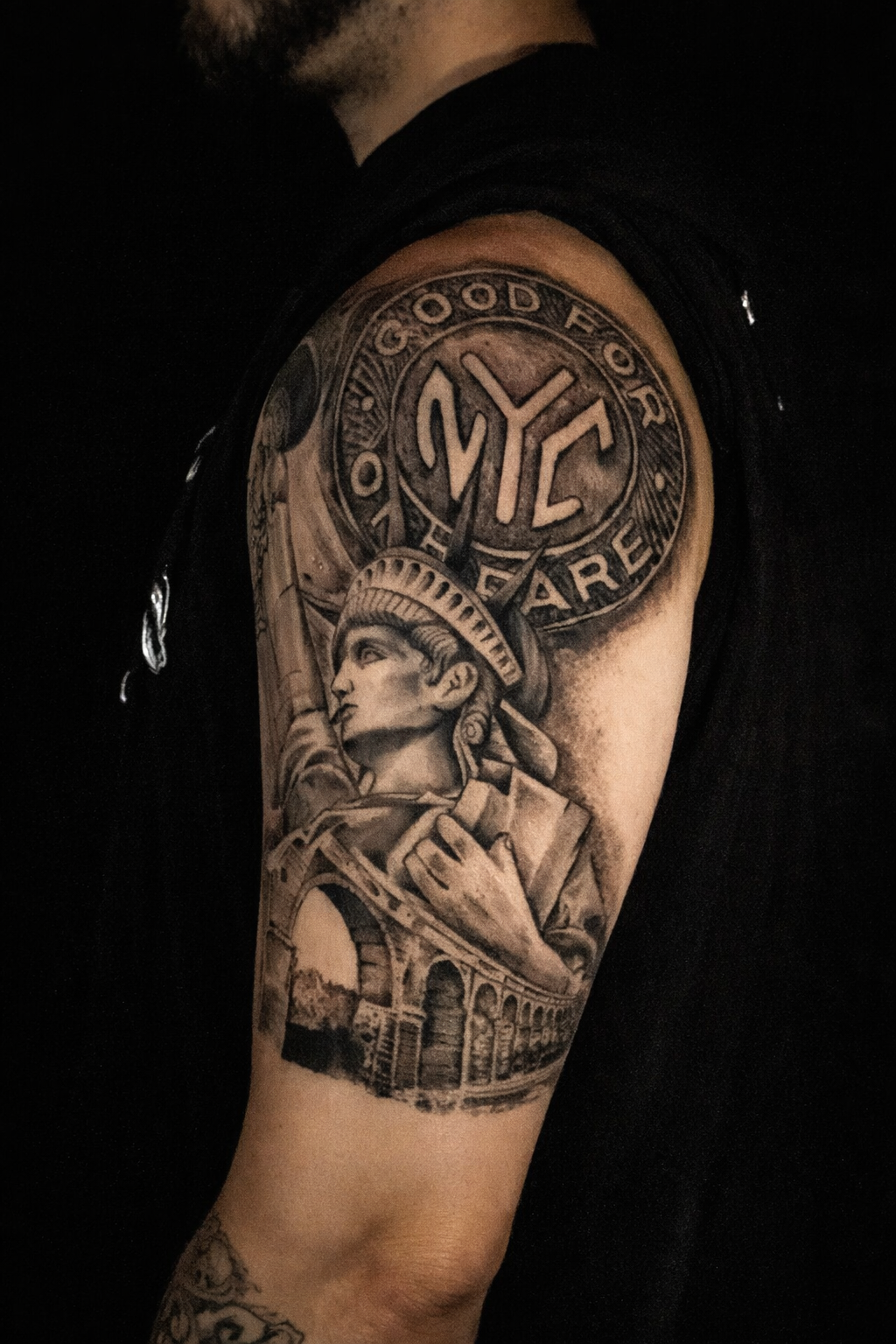 Tattoo of iconic NYC style Statue of Liberty, Highbridge bridge and NYC Token